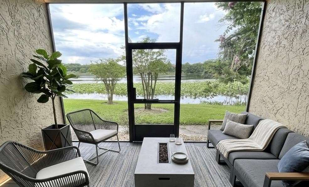 virtually staged back porch with lake views - 145 N PEARL LAKE CSWY #112, ALTAMONTE SPRINGS
