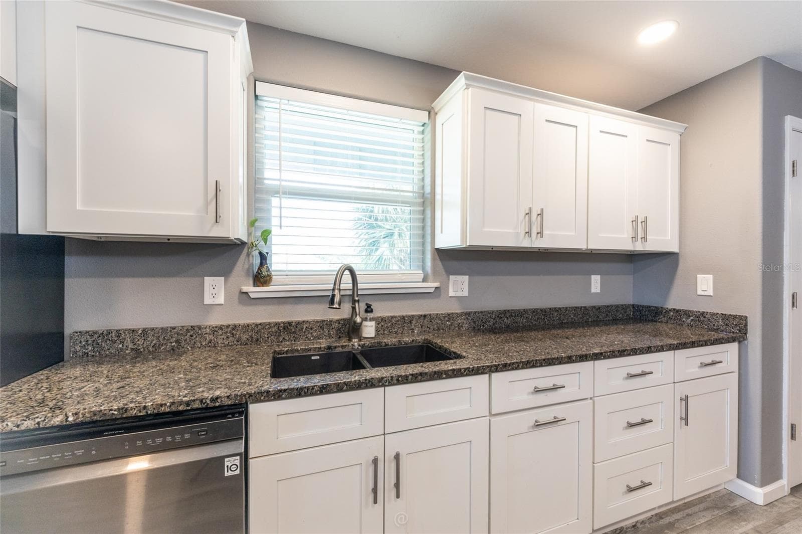 Window over the sink letting in more natural light - 904 S DAYTONA AVE, FLAGLER BEACH