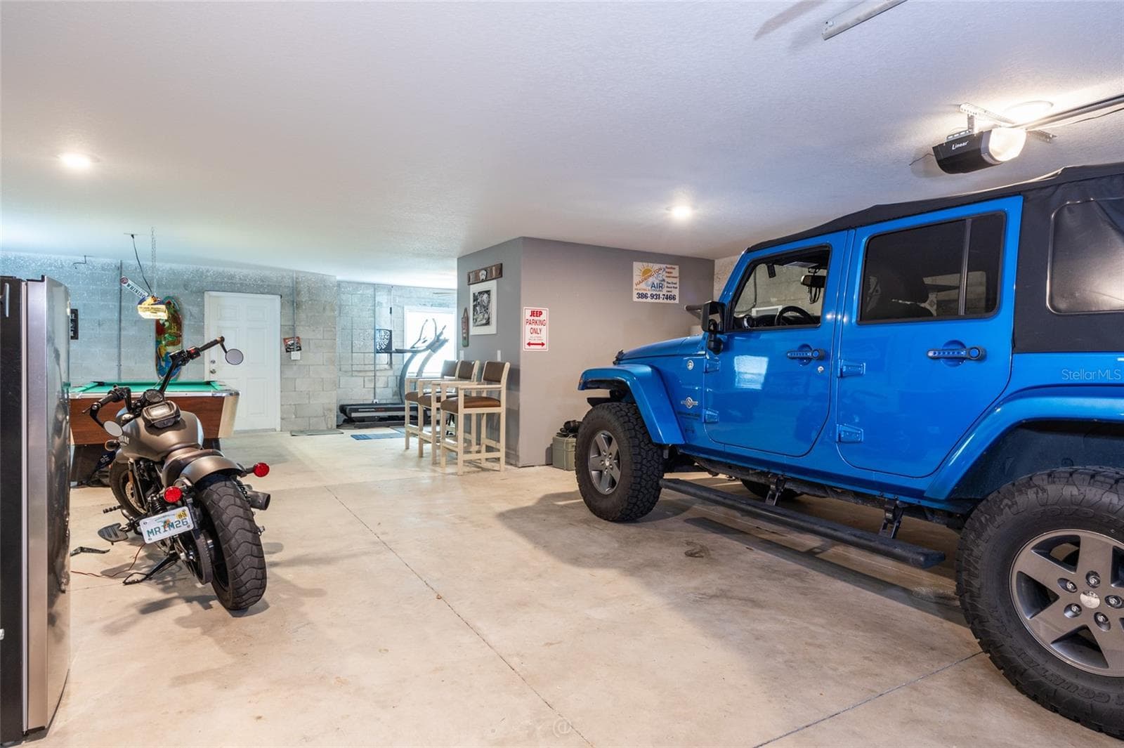 View of the garage & flex space. Split AC system - 904 S DAYTONA AVE, FLAGLER BEACH