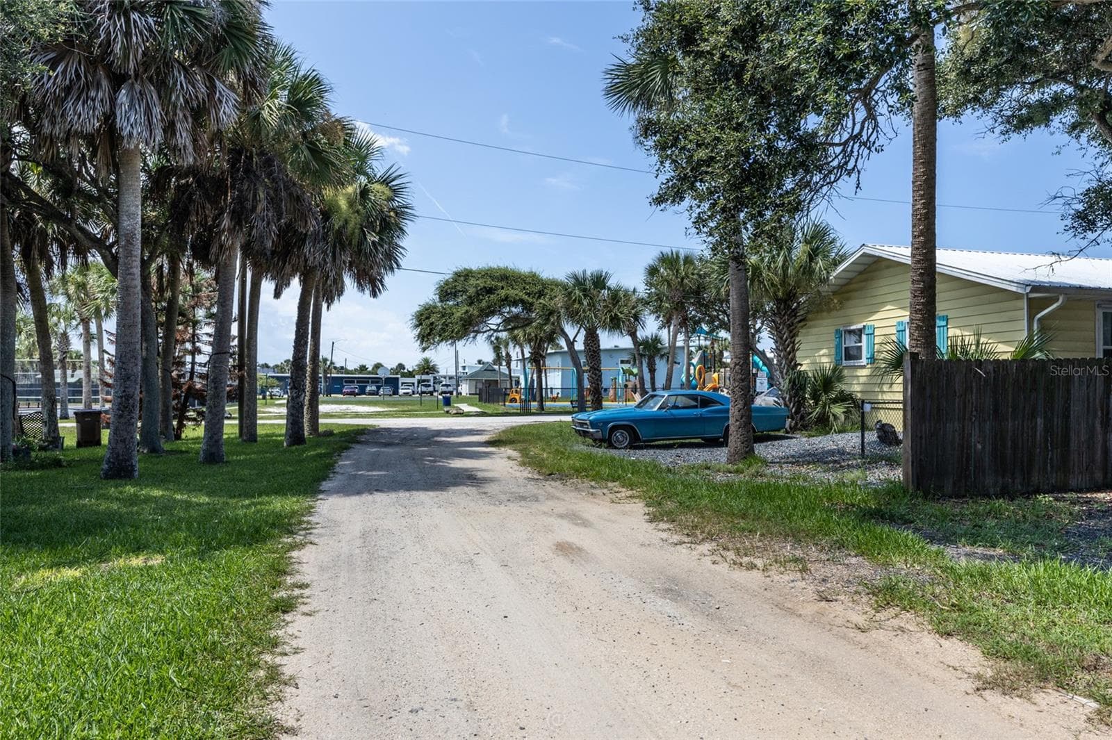 View of alley road behind house facing North - 904 S DAYTONA AVE, FLAGLER BEACH