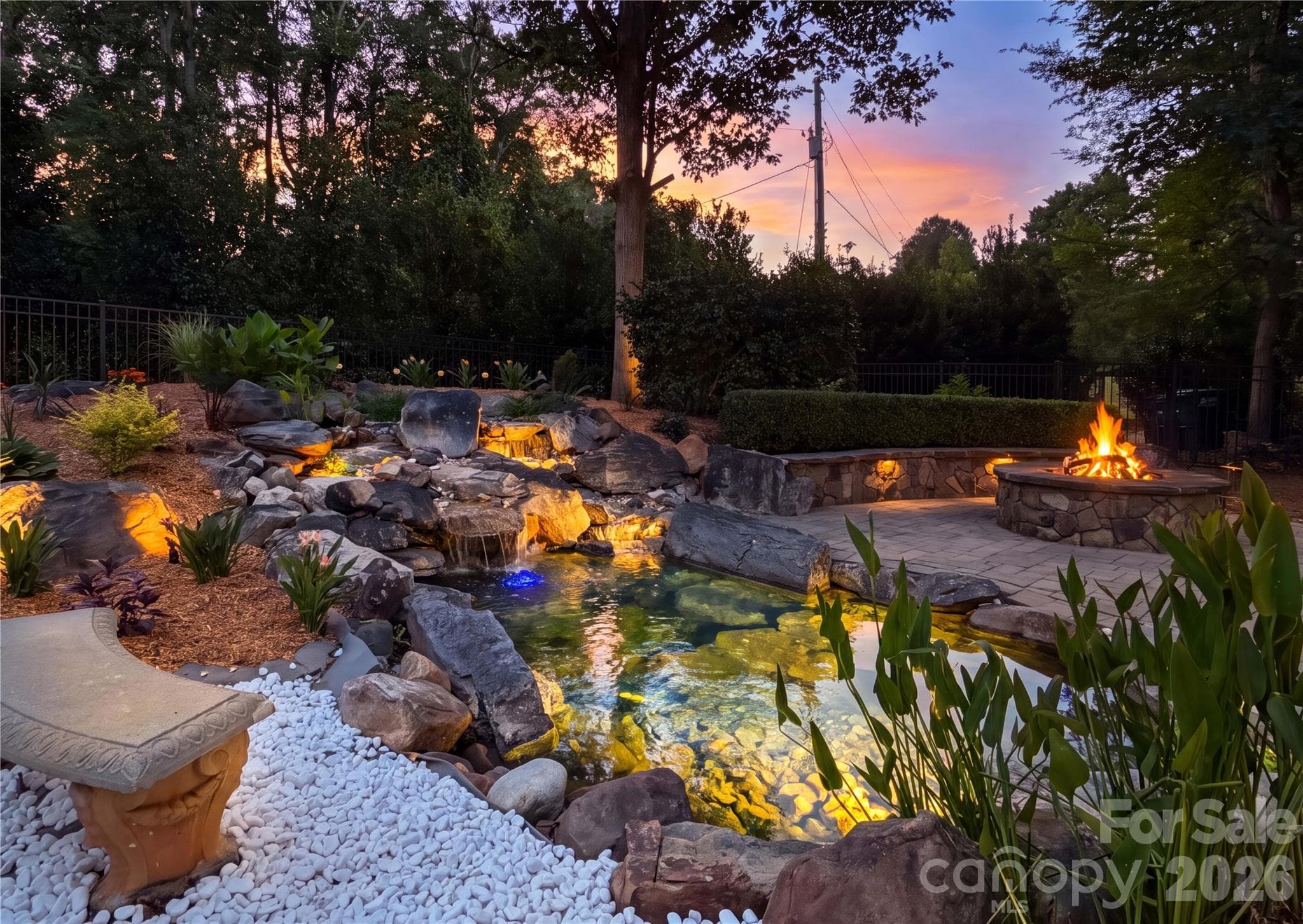 Koi pond with waterfall feature. - Waxhaw