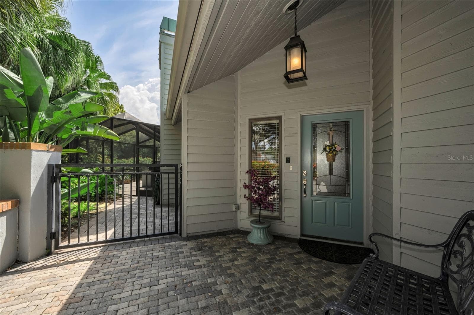 Garden gate and lovely front door entry to your private oasis, 10497 Longwood Drive. - 10497 LONGWOOD DR, SEMINOLE