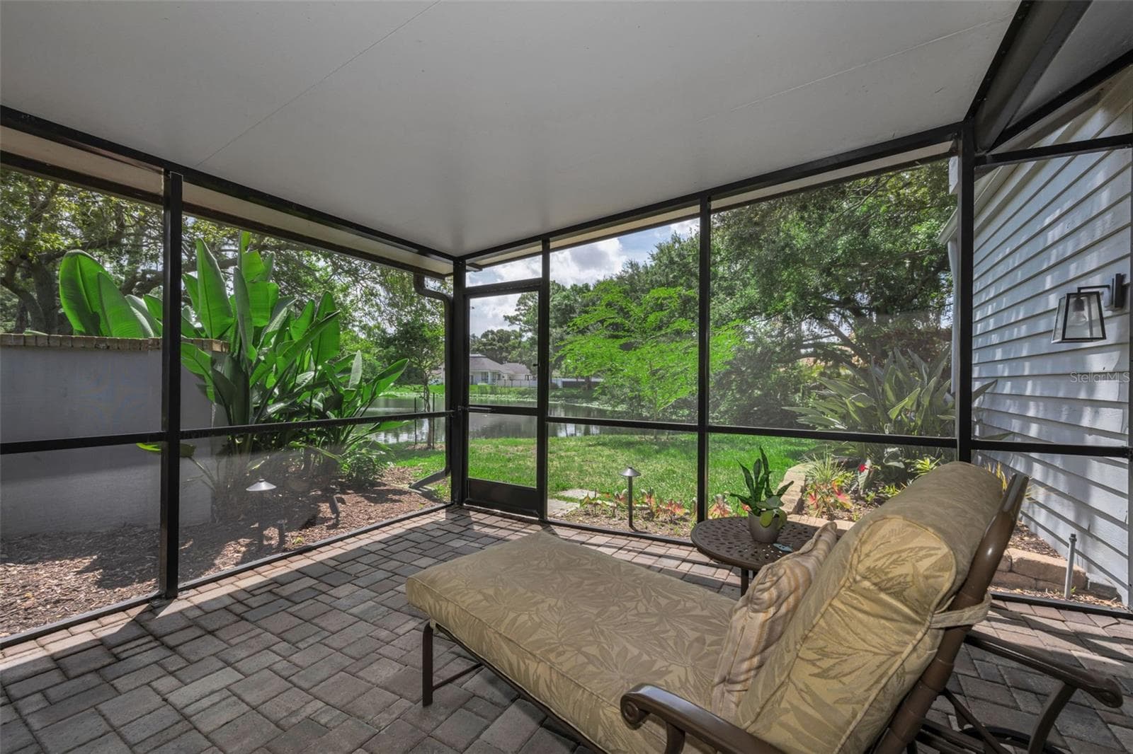 Lanai and Lovely view of the pond, lily pads and dreams of Monet's garden...more later of this lovely area! - 10497 LONGWOOD DR, SEMINOLE
