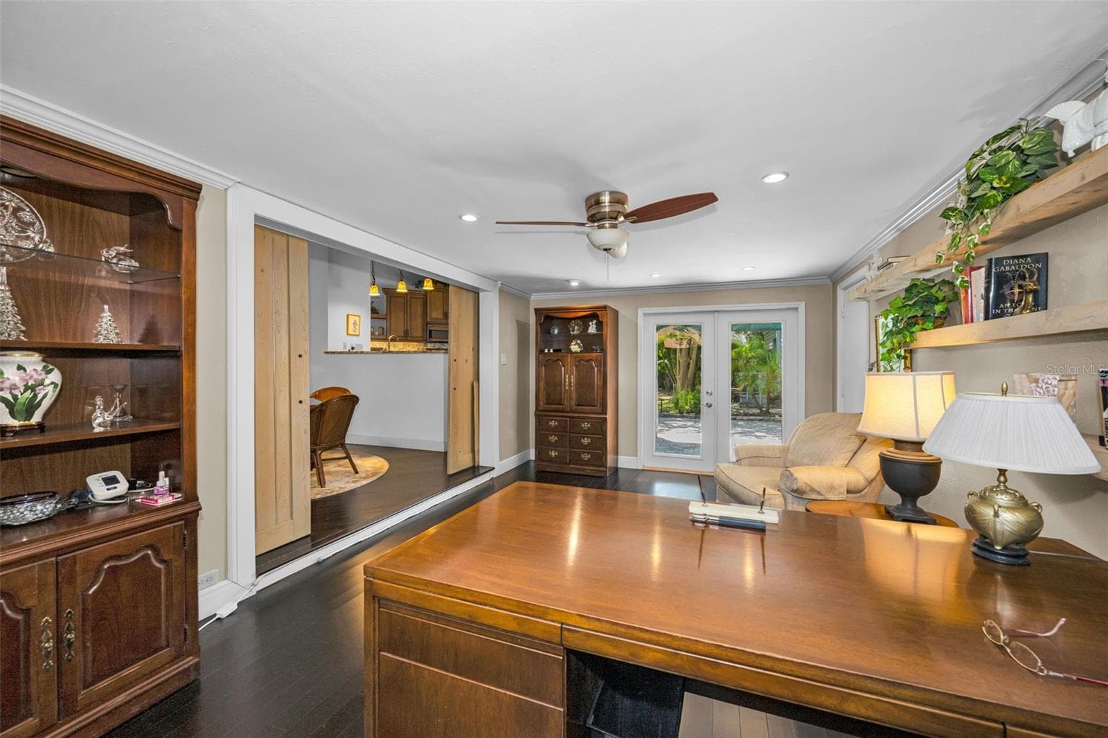 The french doors lead to the back patio which also give you access to the back yard and the pond! - 10497 LONGWOOD DR, SEMINOLE