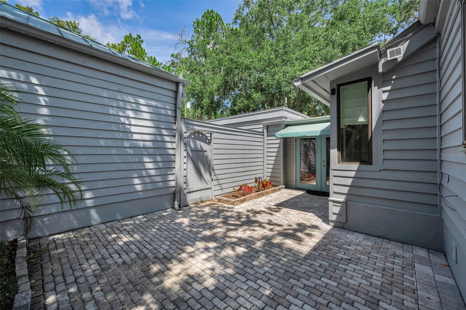 Your private back patio and wonderful pavers make this a lovely spot in the afternoons! - 10497 LONGWOOD DR, SEMINOLE