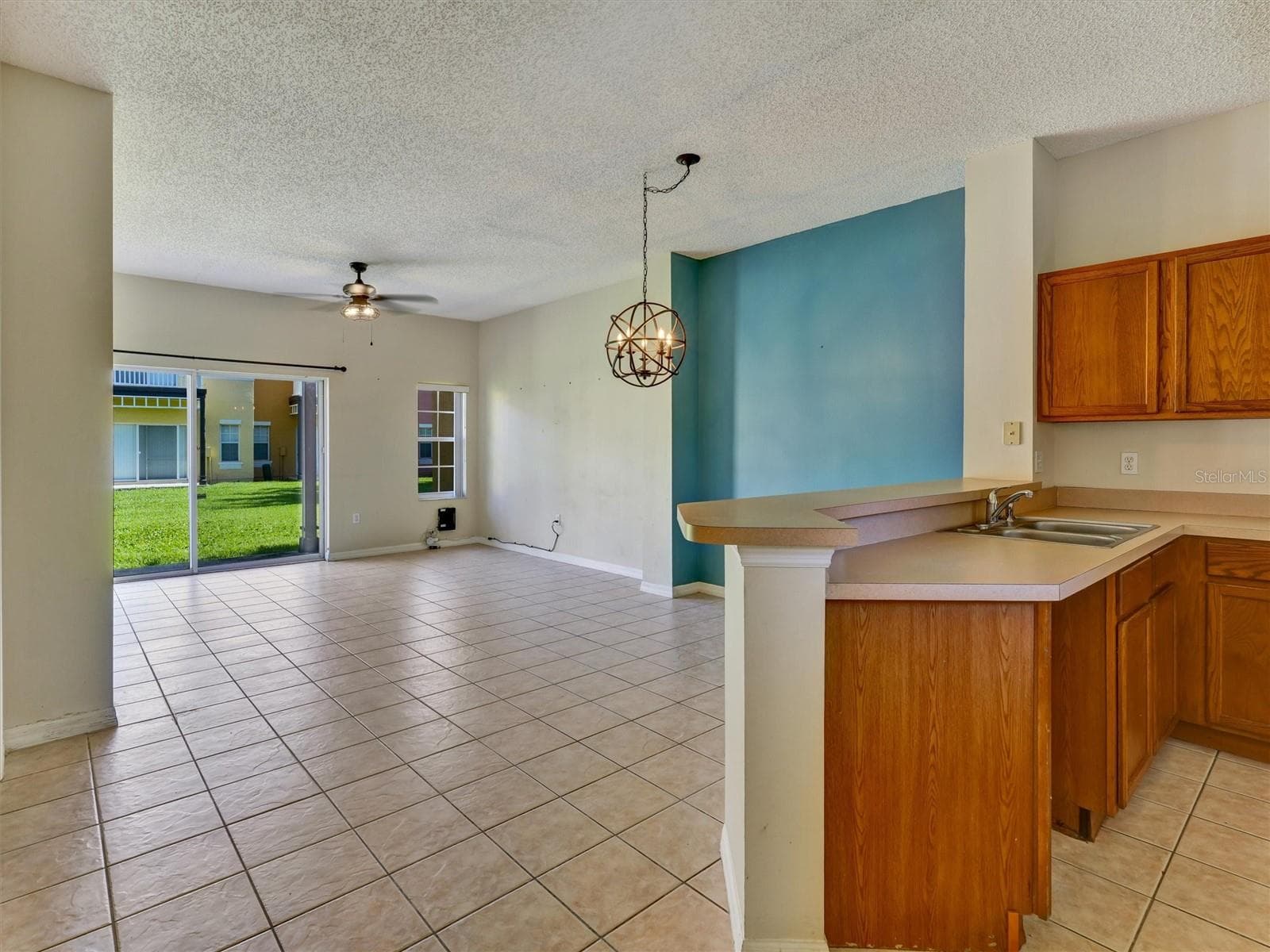 Kitchen with View of the Living & Dining - 8407 BLUE LAGOON DR, KISSIMMEE