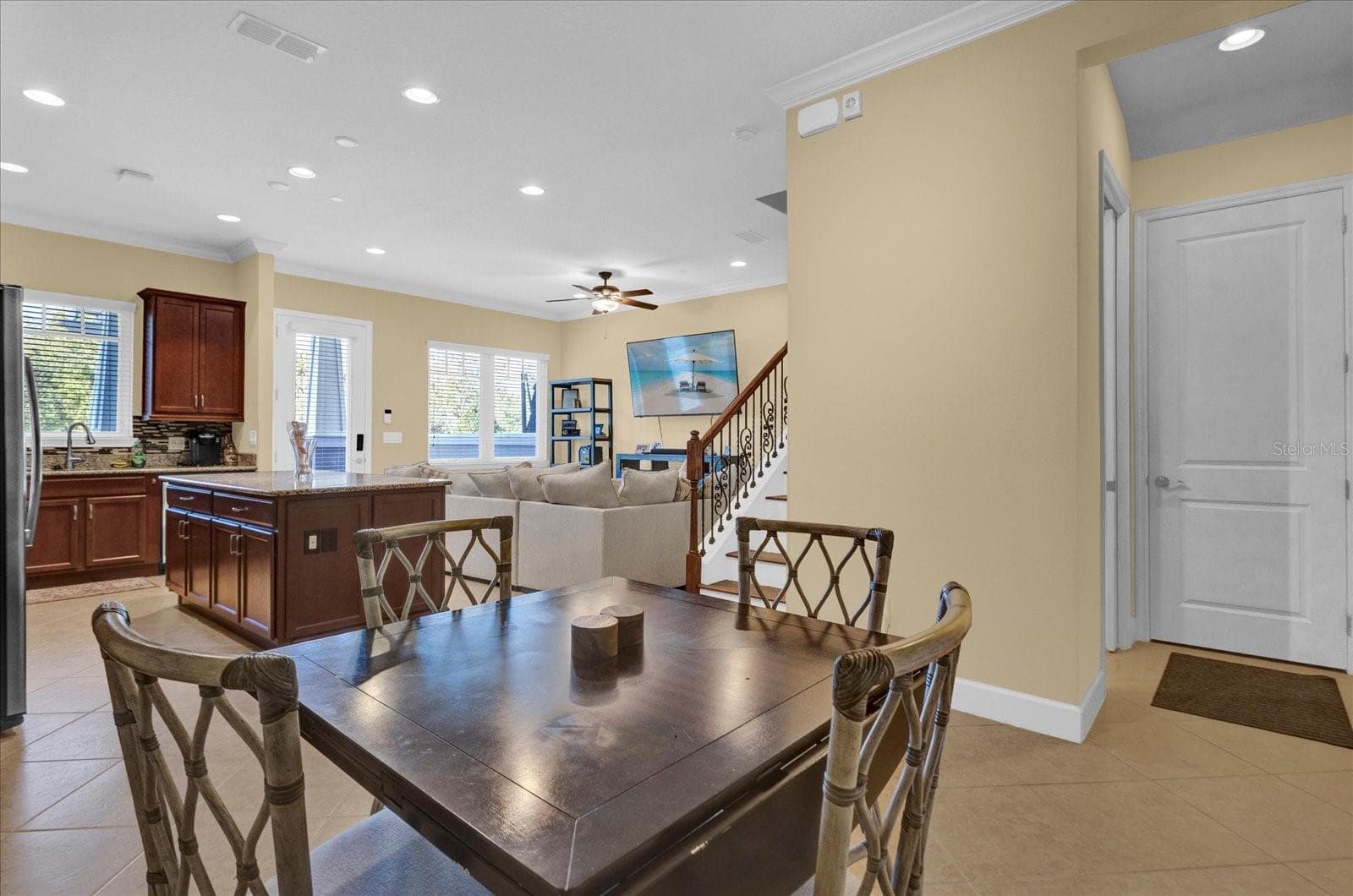Dining space with room for a full table, flowing seamlessly from the kitchen. - 9219 LAUREATE BLVD, ORLANDO