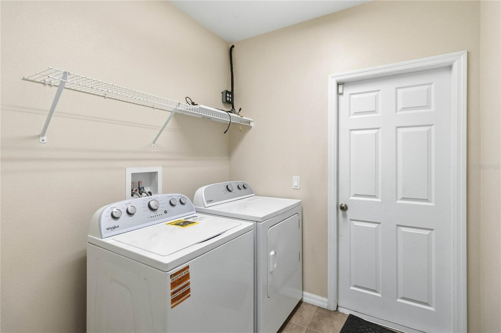 Laundry room to garage - 4069 MARINA ISLE DR, KISSIMMEE