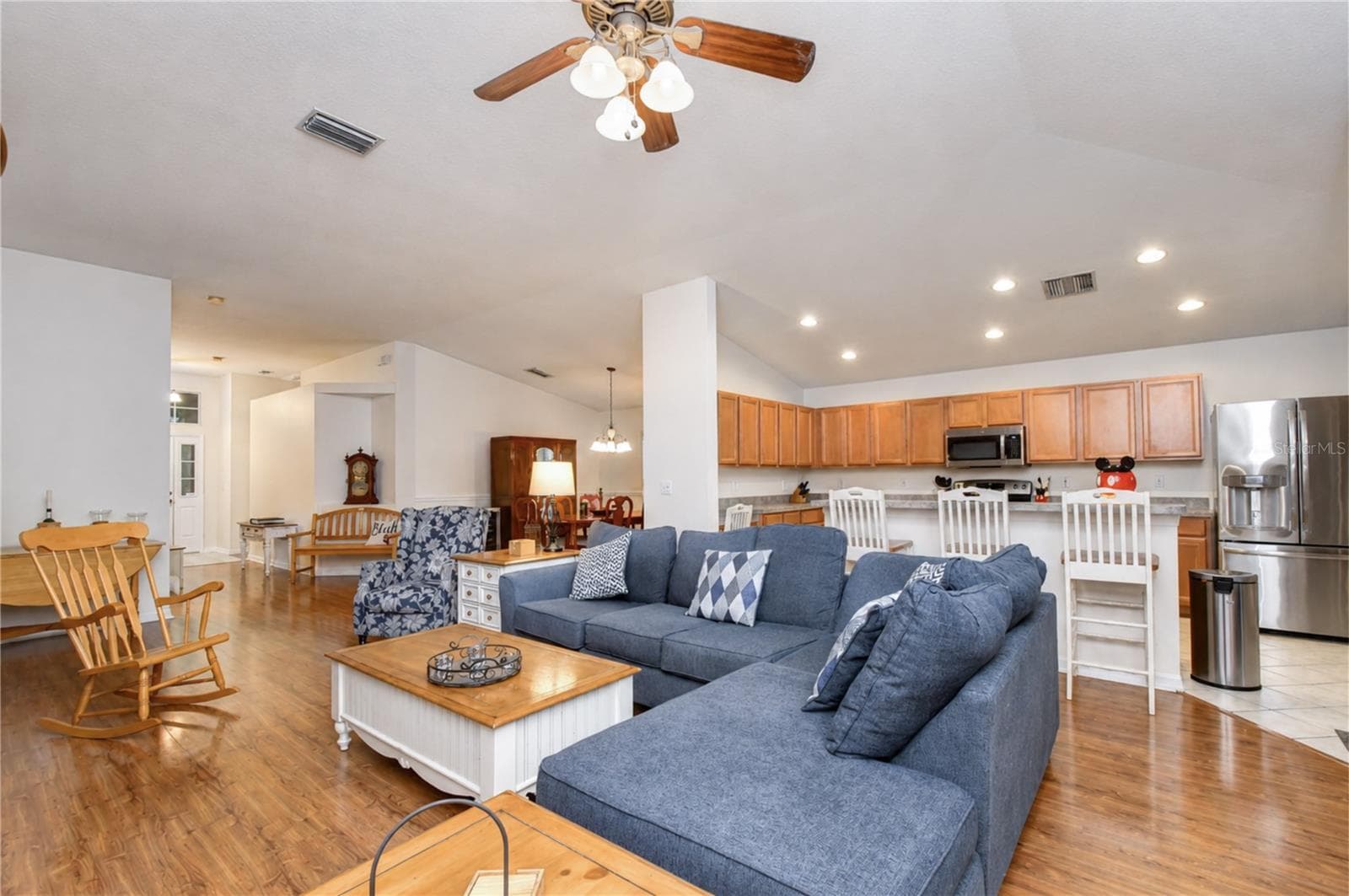 Seamless flow between living, dining, and kitchen spaces. - 6209 GANNETDALE DR, LITHIA
