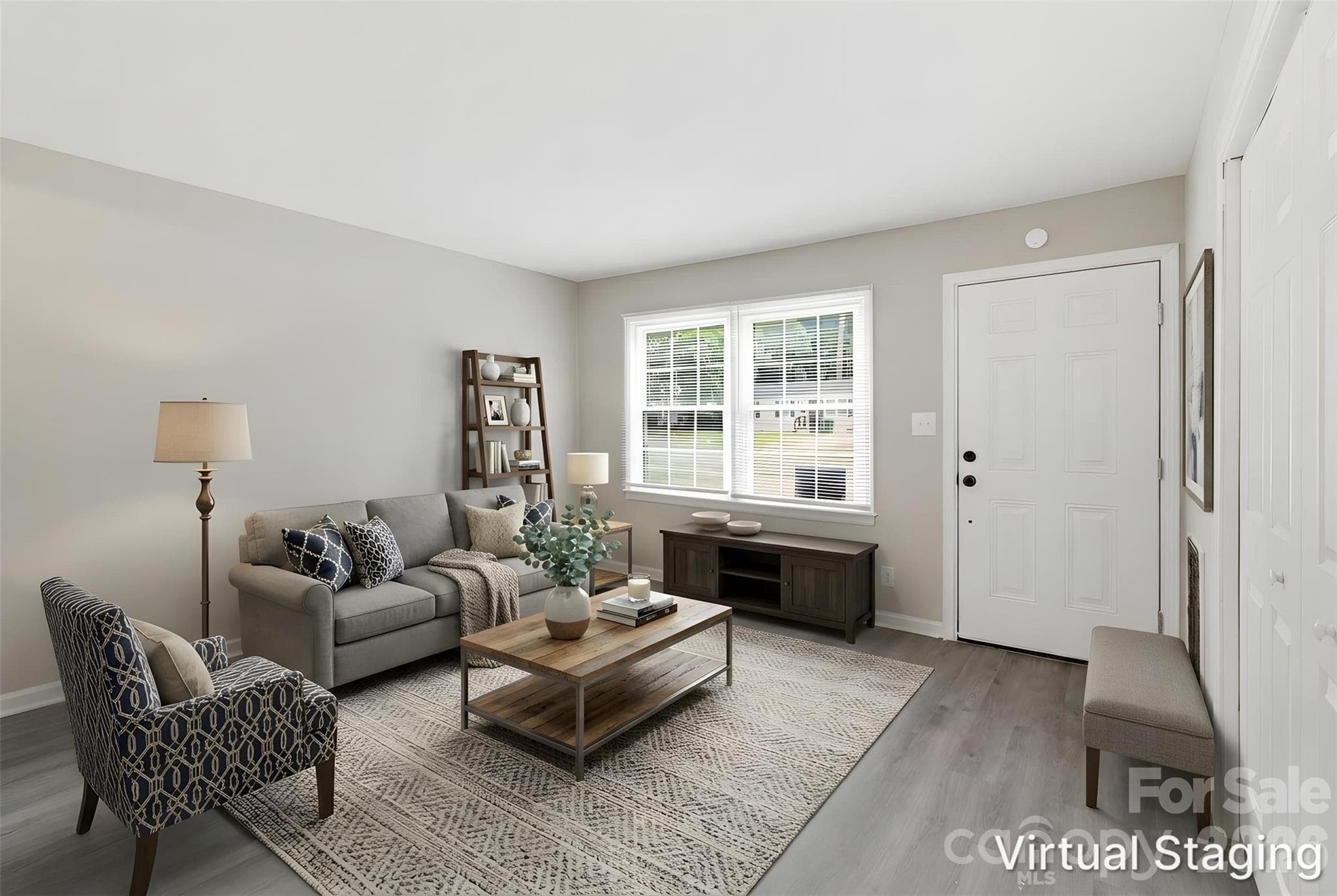 Second shot of the living room, facing entry door. Back is to kitchen (virtually staged & enhanced). - Charlotte