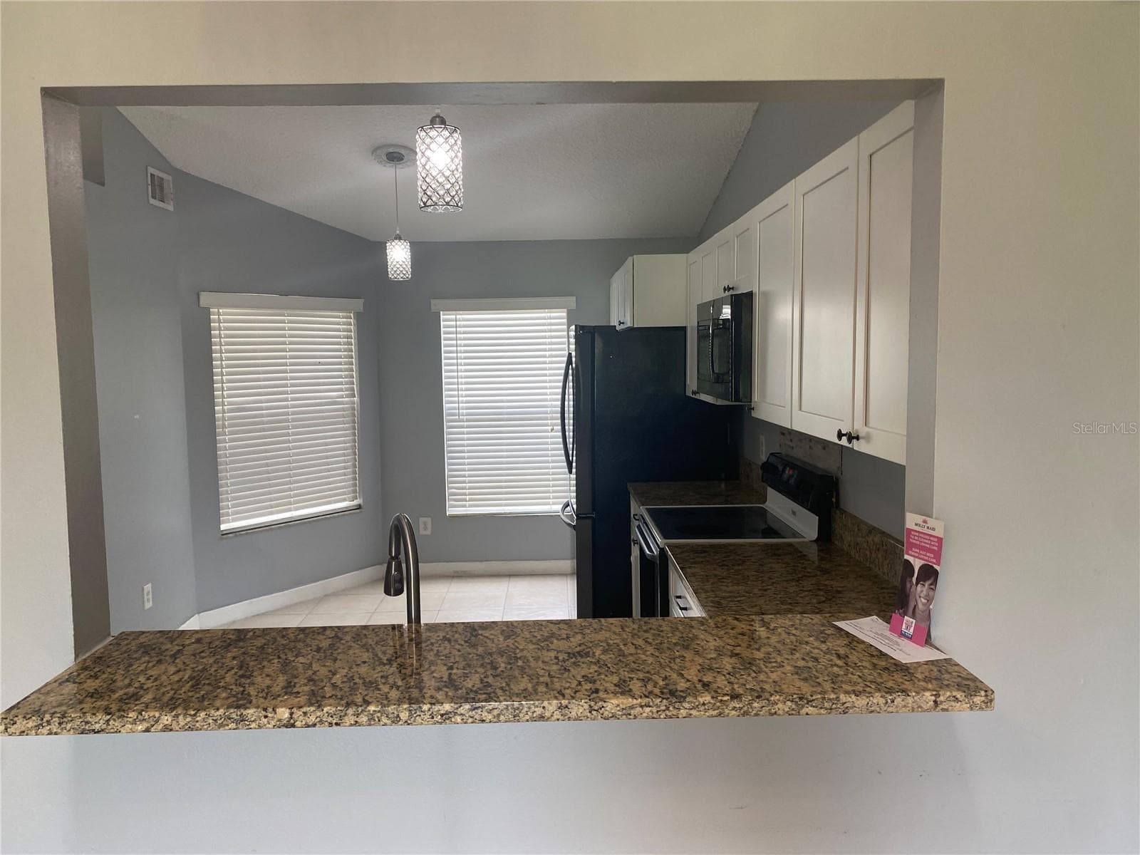 Opening from Kitchen Breakfast Bar. - 82 LAKEPOINTE CIR #82, KISSIMMEE
