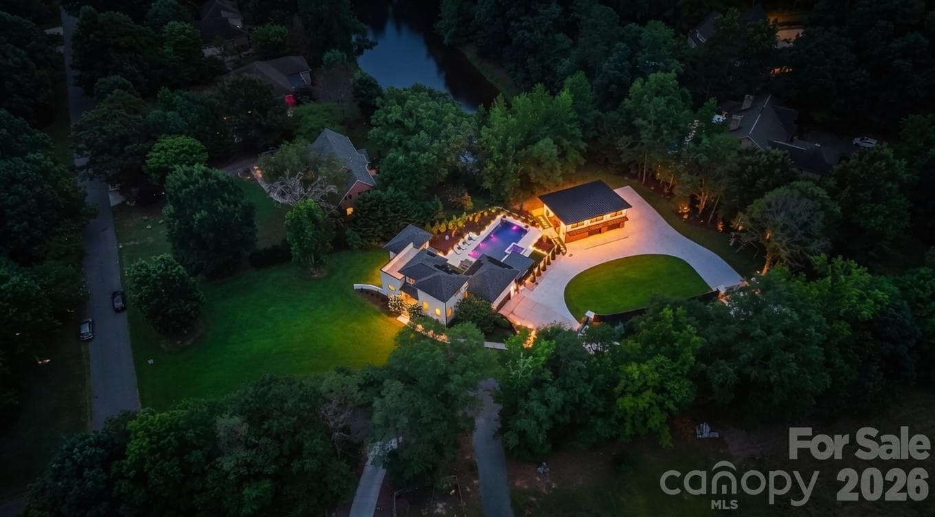 Night Aerial view of luxury 1.58-acre estate property with private gated grounds and mature landscaping - 1064 Greylyn Drive, Matthews