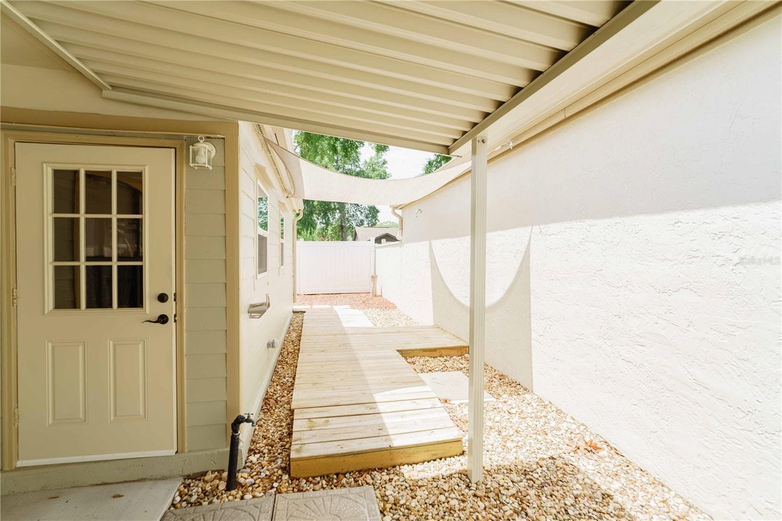 Covered patio with walkway to backyard - 4418 NE 4TH ST, OCALA