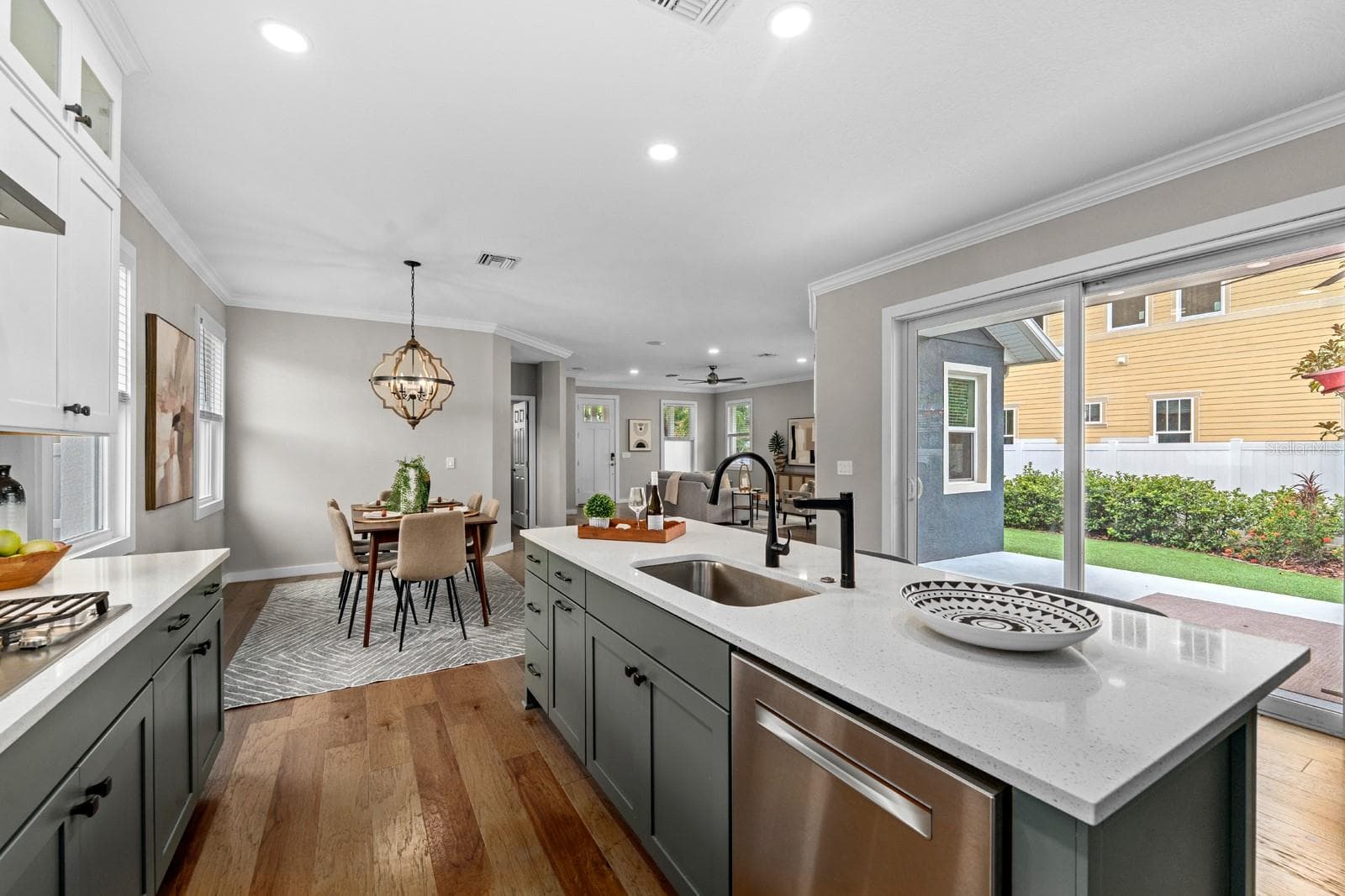 the wall of sliding glass doors lets the light in and makes grilling easy - 1028 5TH ST N, ST PETERSBURG