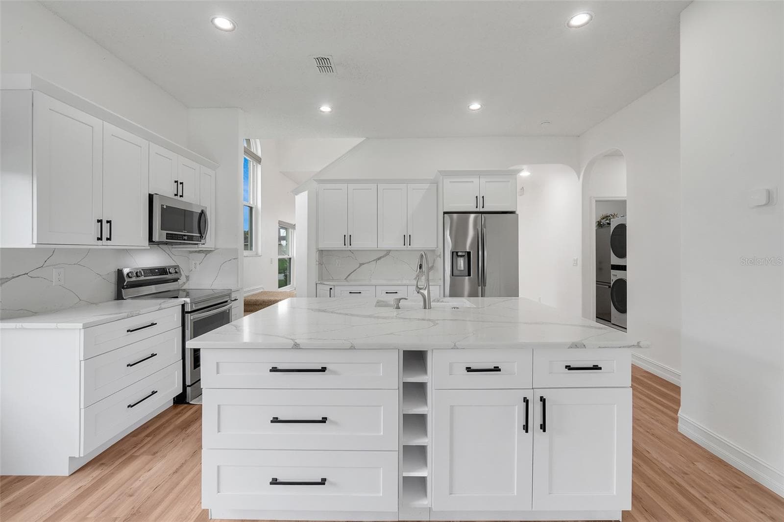 Kitchen island with added storage - 16740 GLENBROOK BLVD, CLERMONT