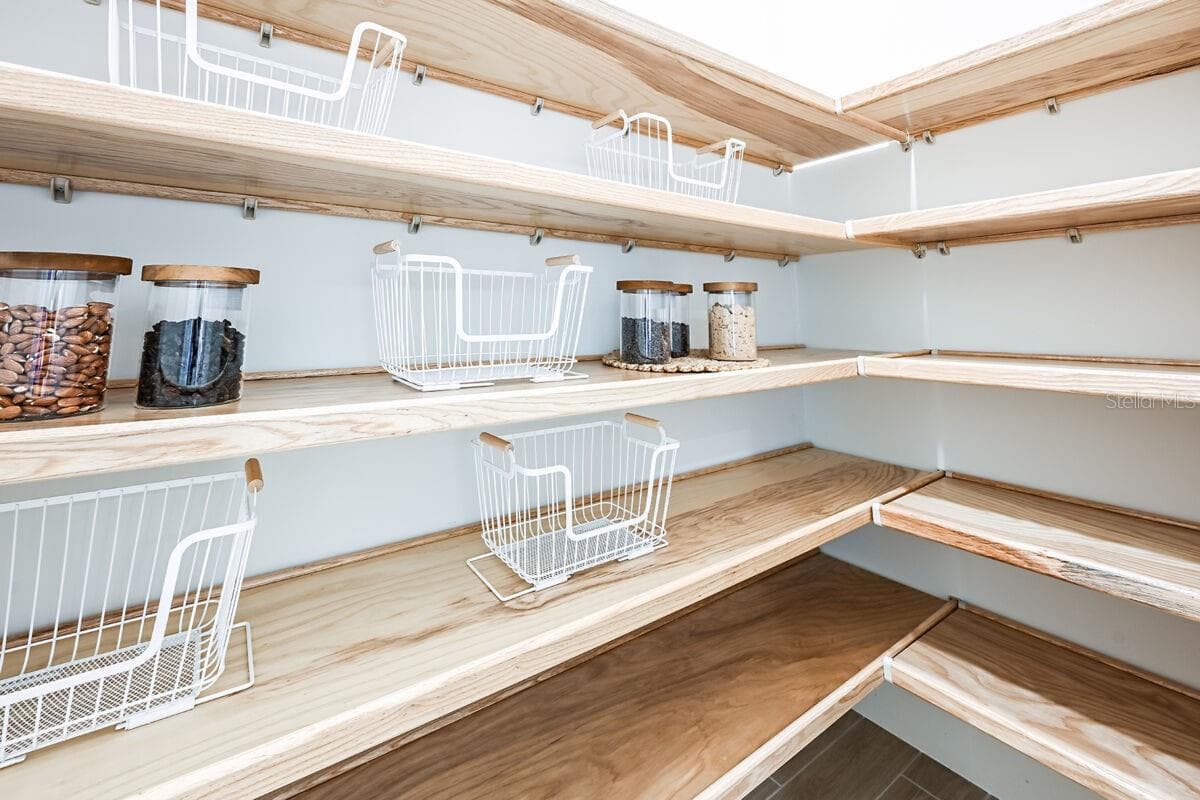 Pantry-Photo description represents the model home of same floor plan. - 17524 MACARTHUR LOOP, VENICE