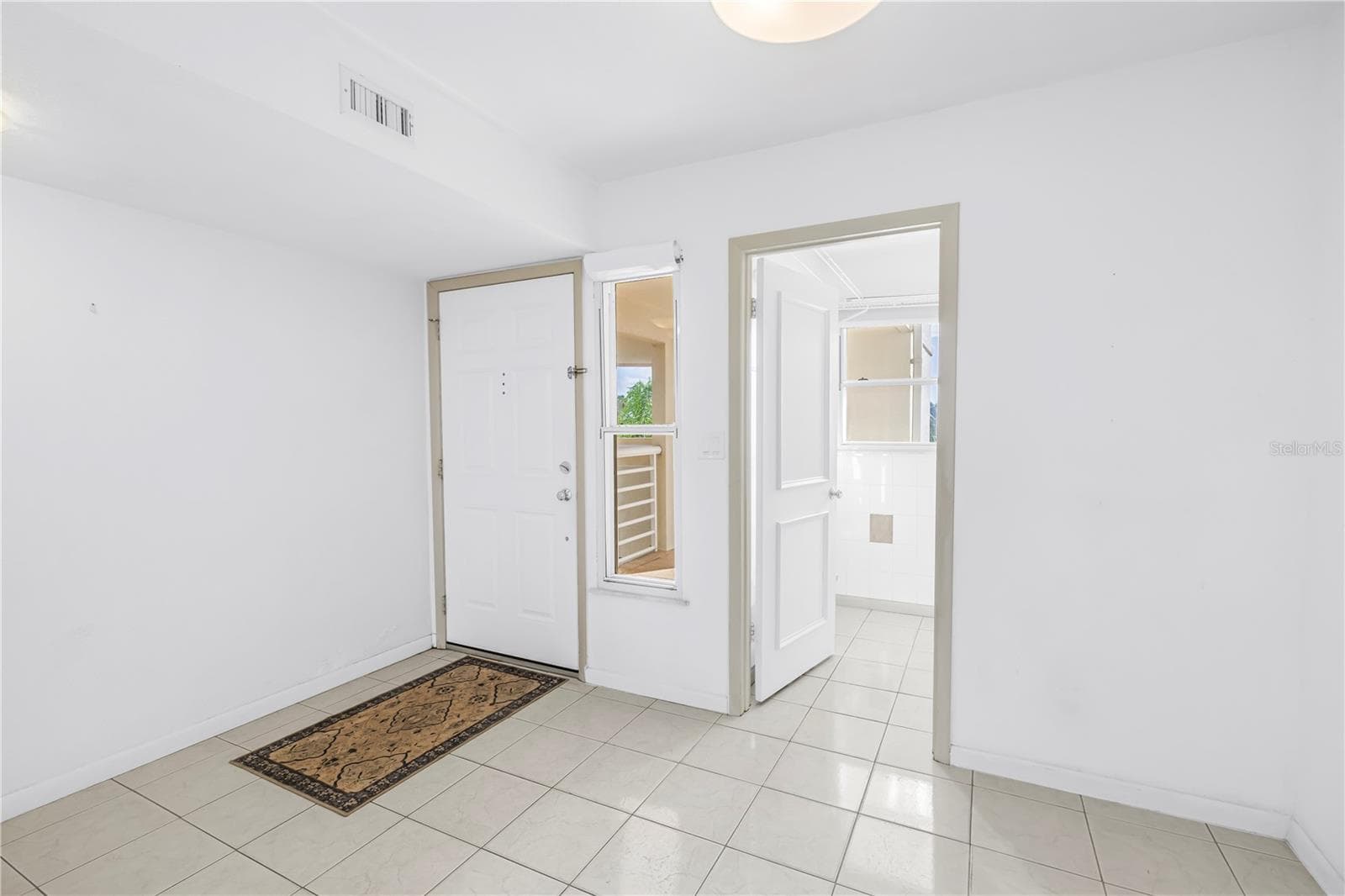 Front Door and door to laundry room - 6001 BAHIA DEL MAR CIR #428, ST PETERSBURG