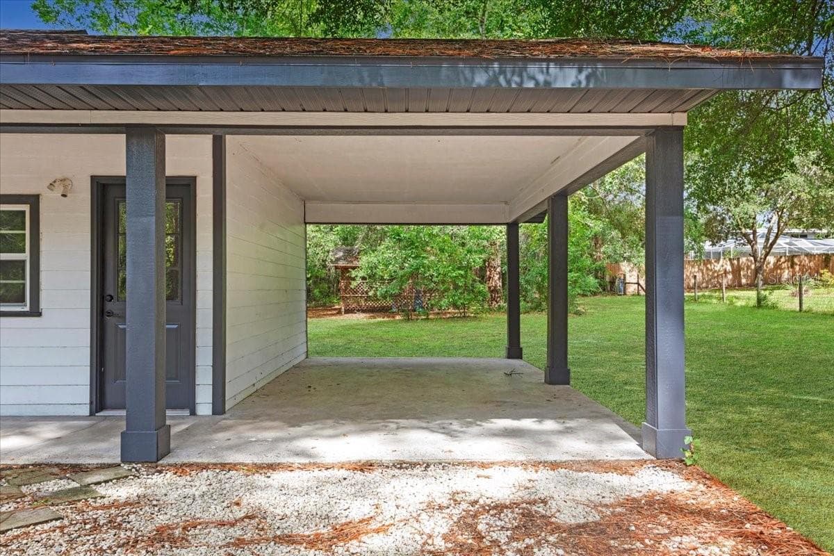Carport and front entry to third bedroom - 5309 NE 60TH AVE, HIGH SPRINGS