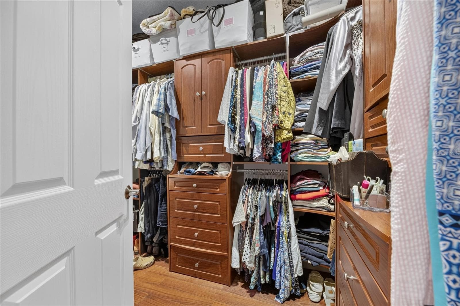 Master Bedroom Closet with Built-in Cabinetry - 7508 DUNBRIDGE DR, ODESSA