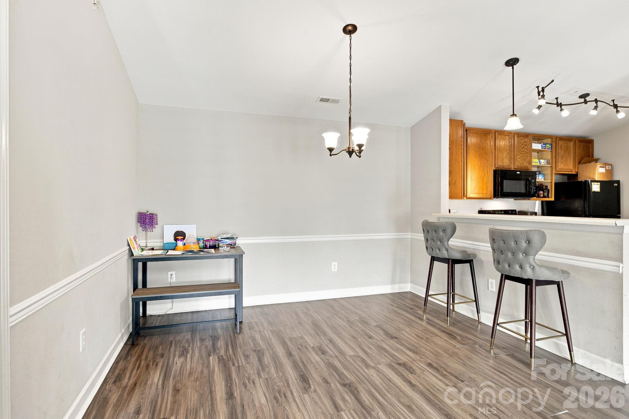 Dining Area w/ Breakfast Bar into Kitchen - 17257 Doe Valley Court, Cornelius