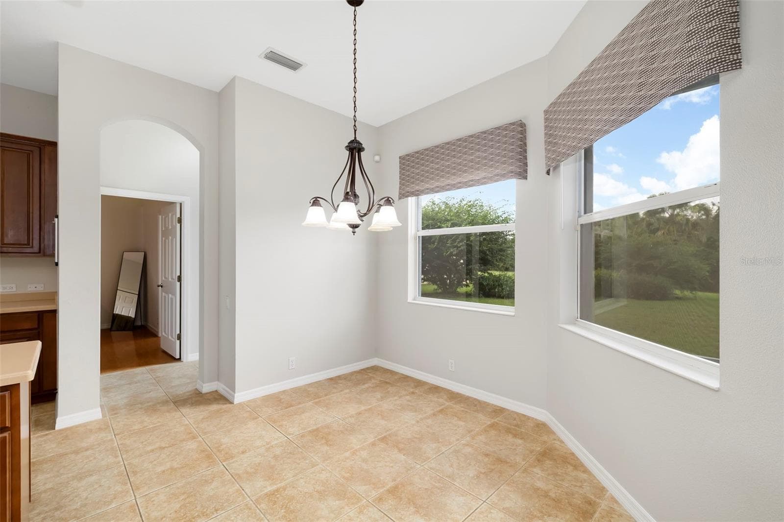 Eating space in kitchen with views of the tranquil backyard - 1111 BRAMBLING CT, BRADENTON
