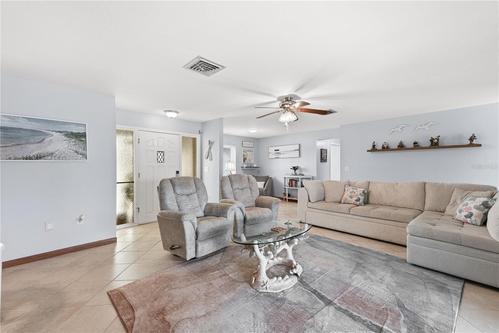 Spacious Living Room with Electric Fireplace and Pool Access - 2284 BROAD RANCH DR, PORT CHARLOTTE