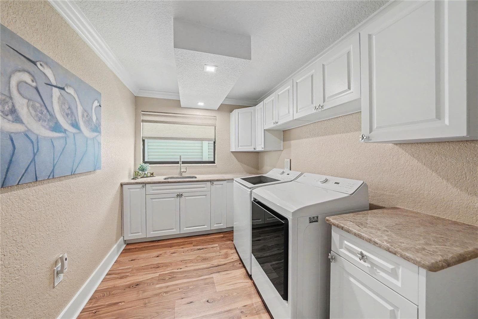 First level oversized laundry room offers more storage, new cabinets, & new washer and dryer. - 19936 GULF BLVD, INDIAN SHORES