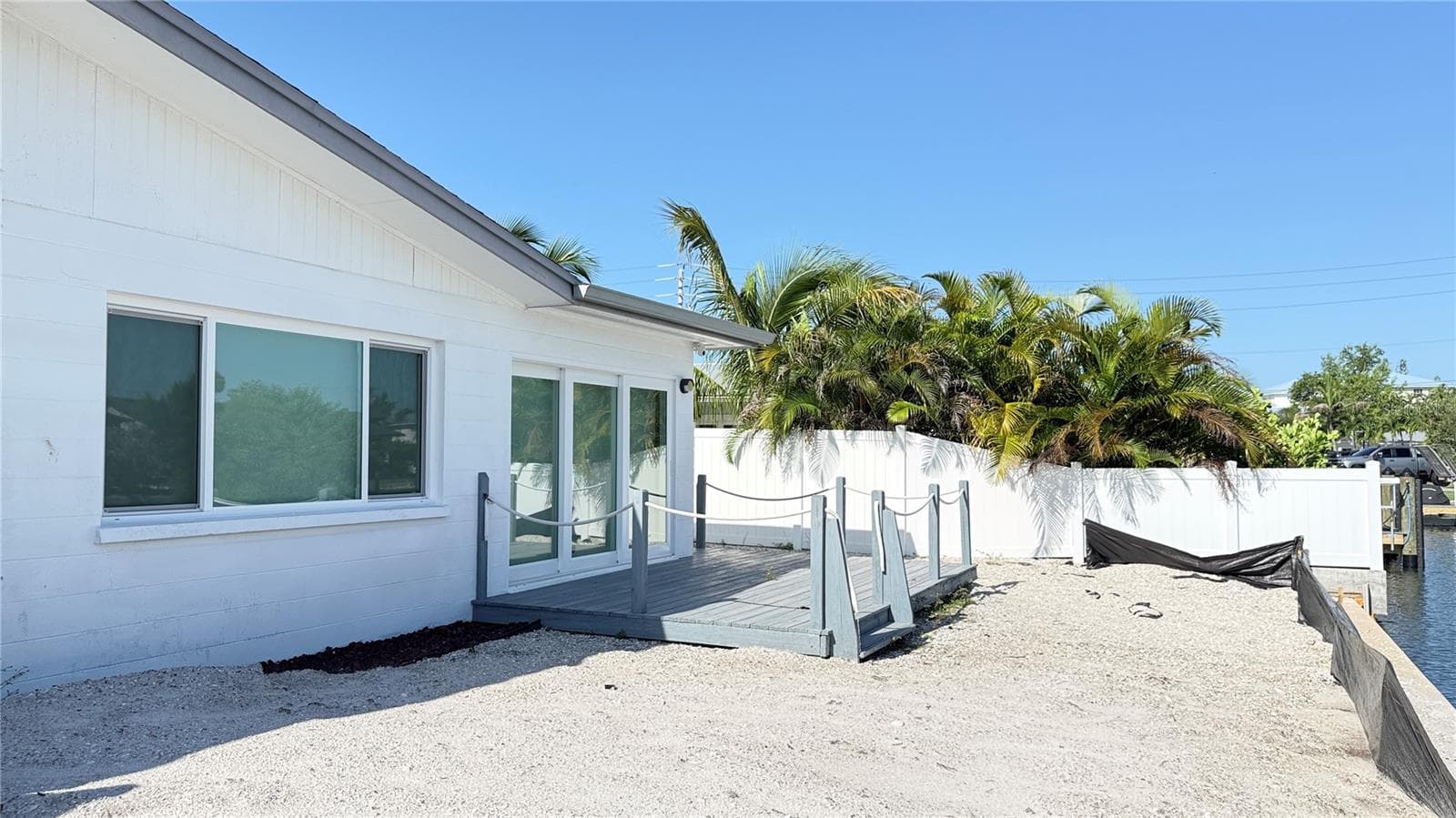 Rear of Unit showing sliders to deck and canal - 420 63RD ST #420A, HOLMES BEACH