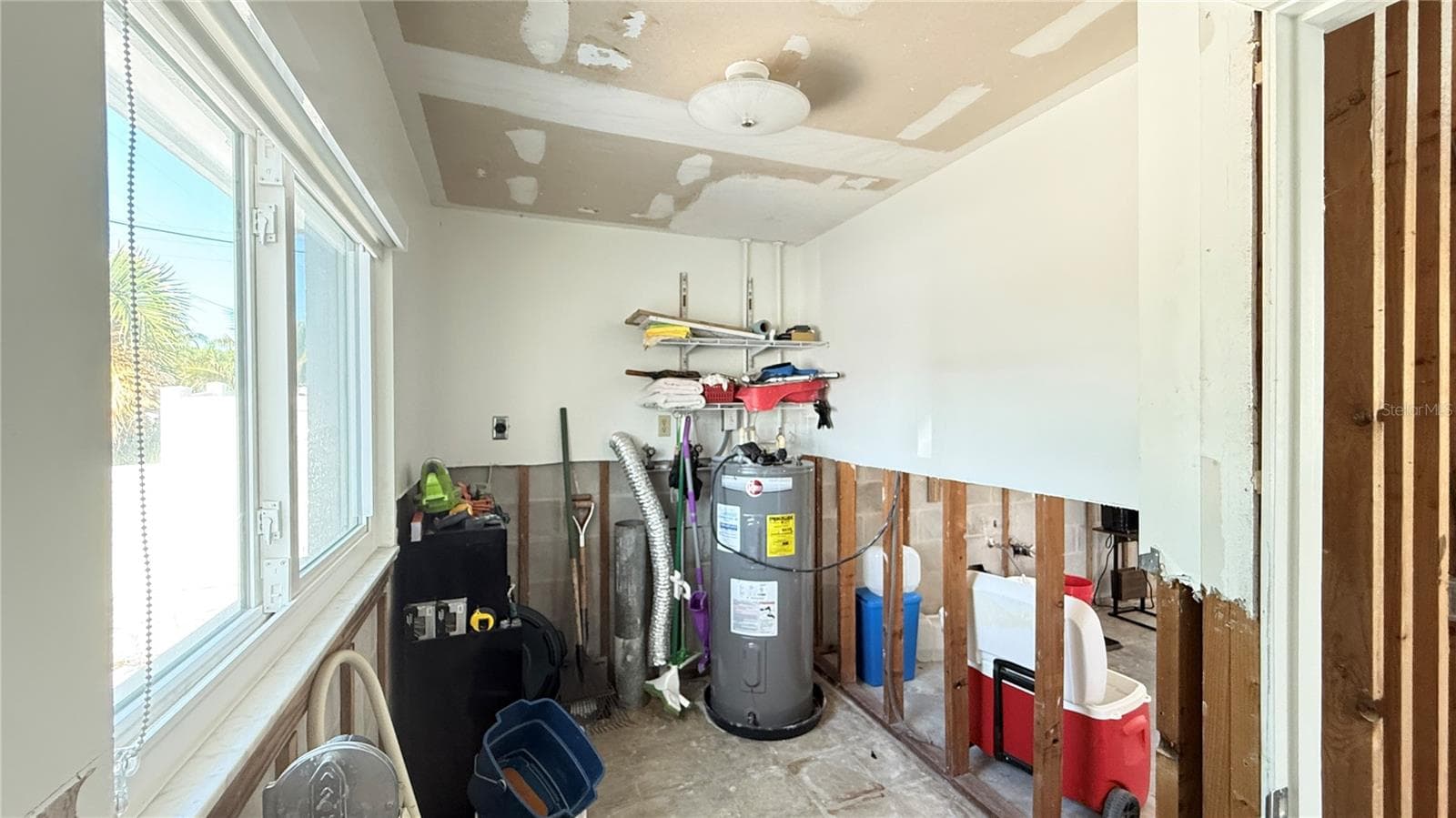 Laundry/storage room located in the front of the unit. - 420 63RD ST #420A, HOLMES BEACH