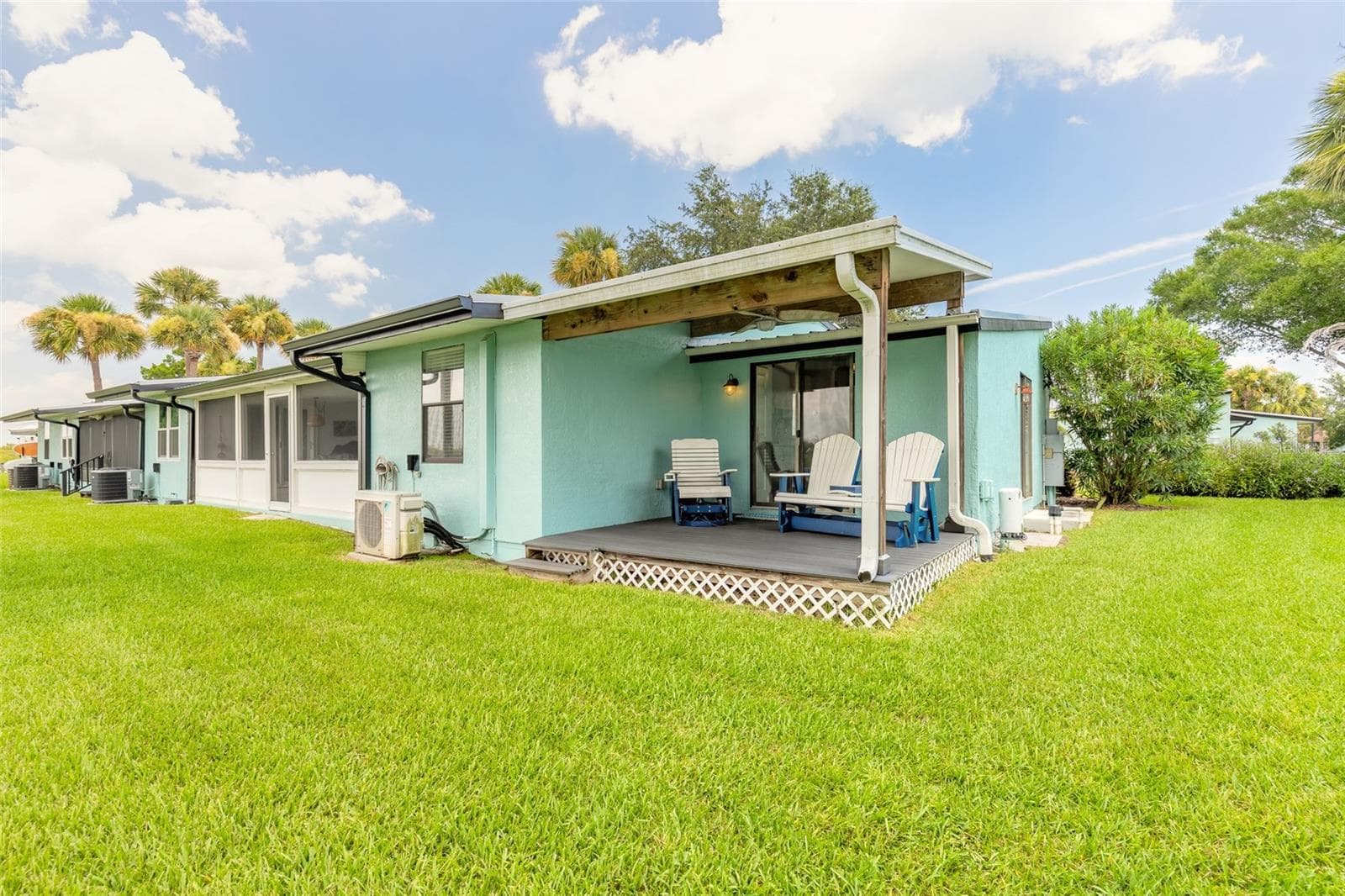 rear covered porch on water with view - 76 HEATHER POINT CT, NEW SMYRNA BEACH