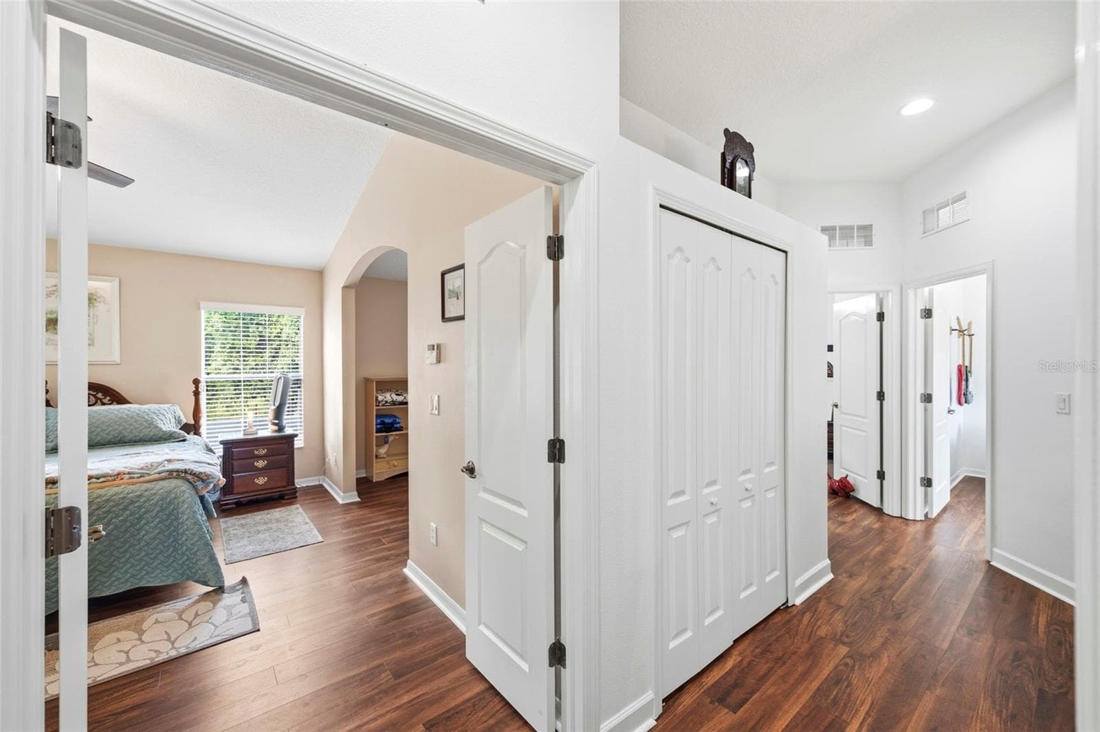 View into the Primary bedroom. - 11507 BELLE HAVEN DR, NEW PORT RICHEY