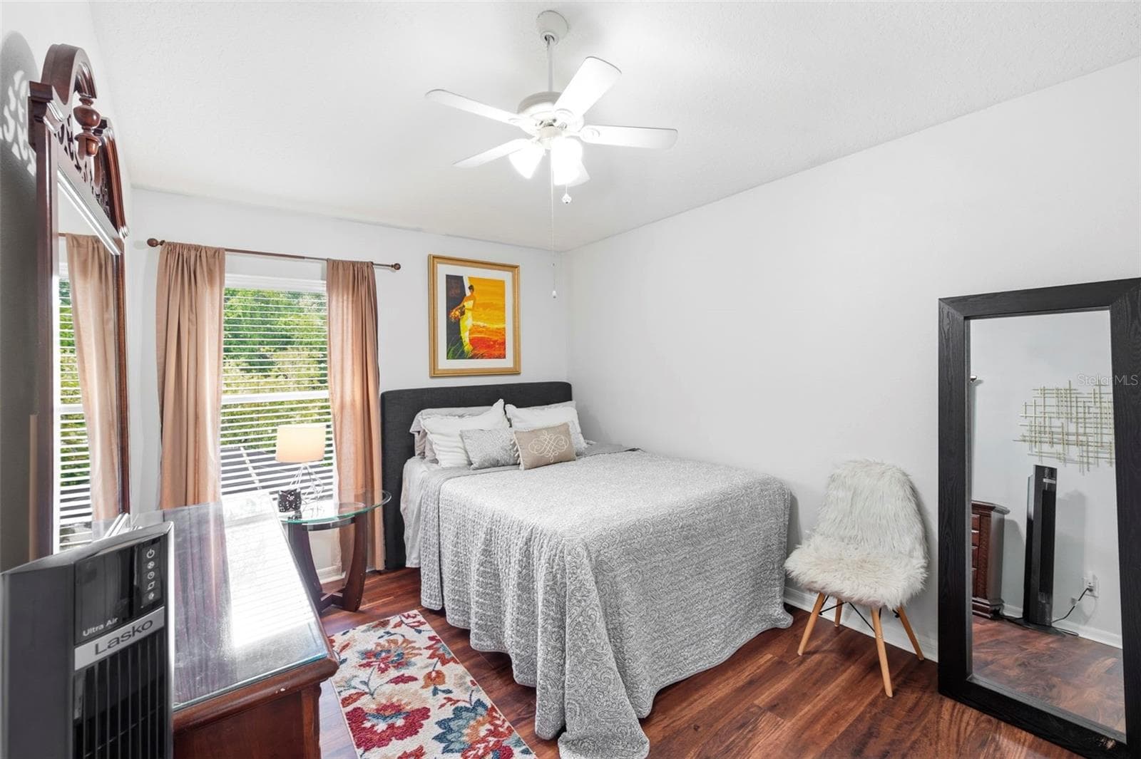 This bedroom has a pool view. - 11507 BELLE HAVEN DR, NEW PORT RICHEY