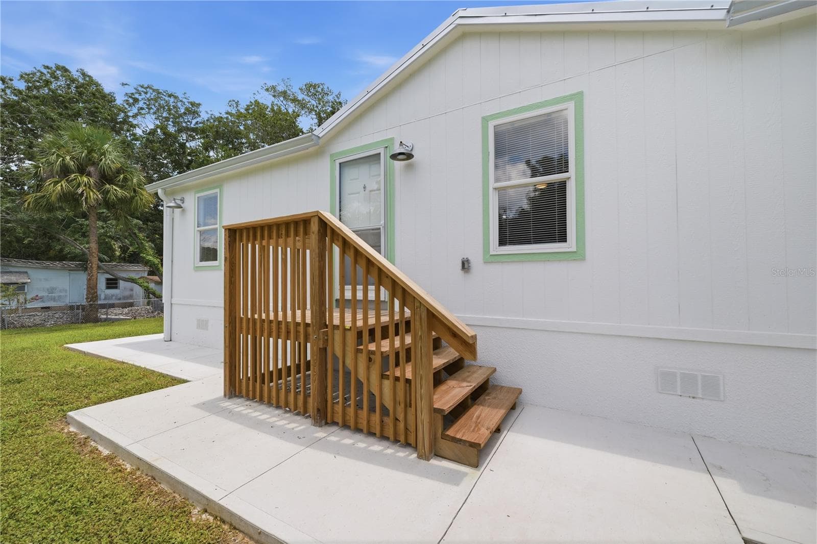 side entrance off the laundry room - 7904 CADILLAC AVE, HUDSON