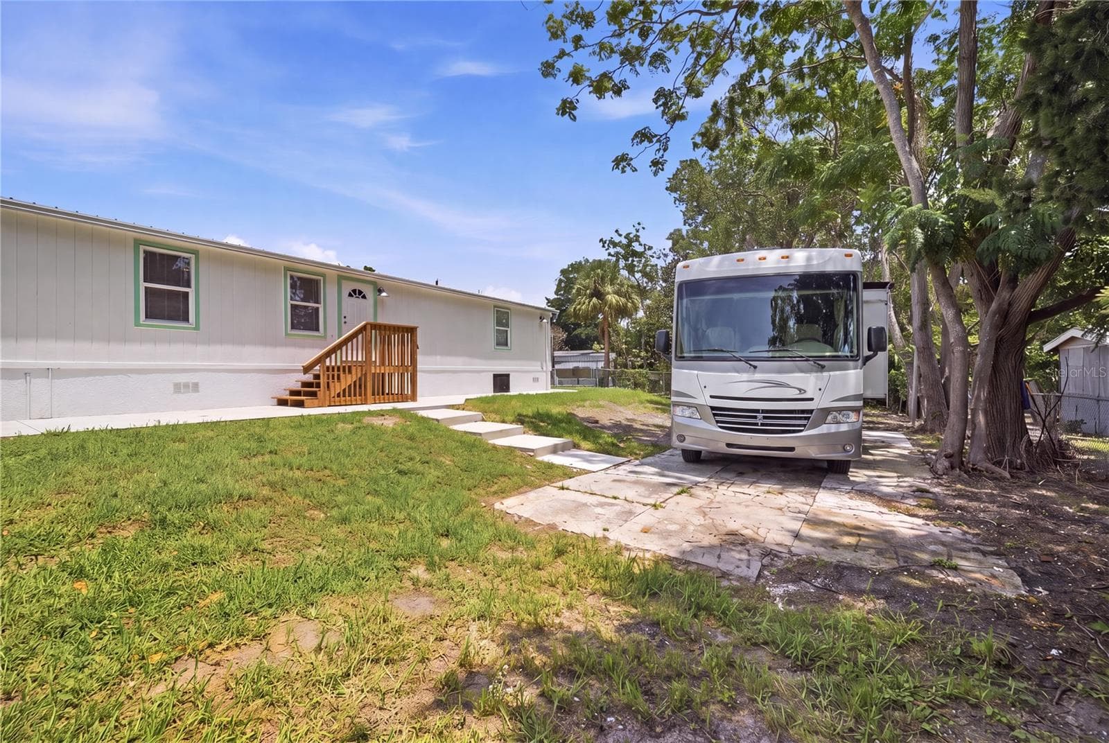 long concrete pad in backyard - 7904 CADILLAC AVE, HUDSON
