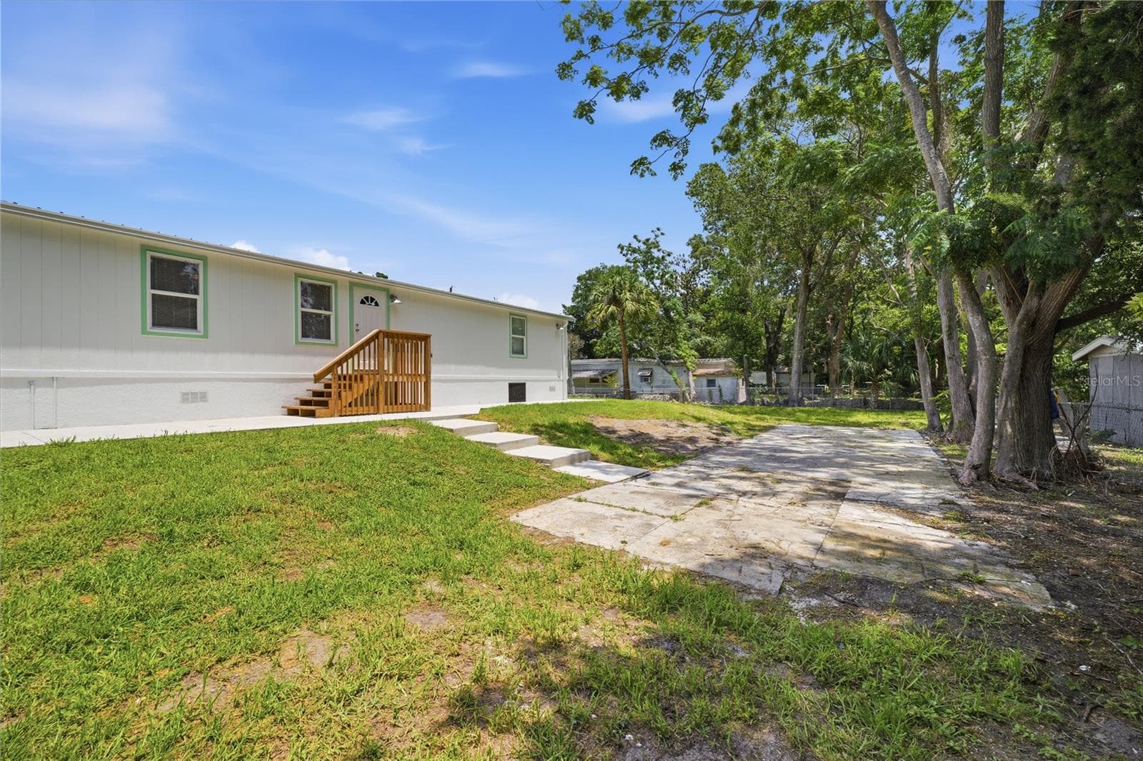 large concrete pad for more parking or a shed - 7904 CADILLAC AVE, HUDSON