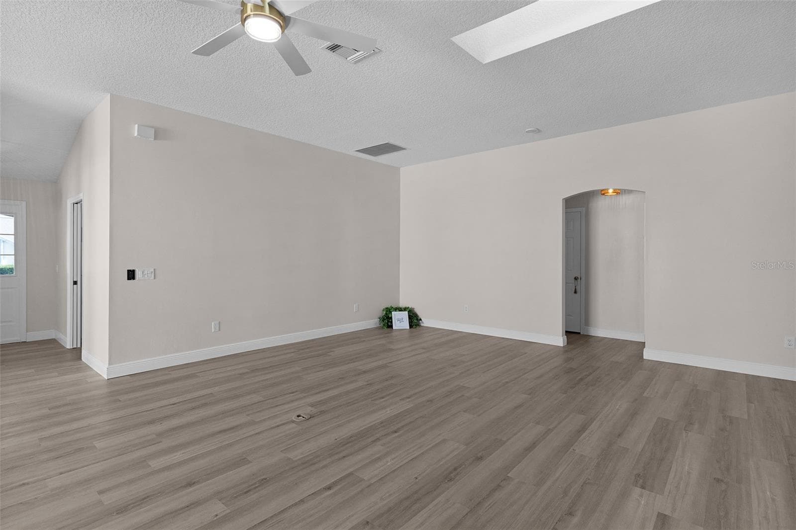 The new LVP flooring flows throughout the whole home. No carpeting and all brand new. - 1012 DIEGO CT, LADY LAKE