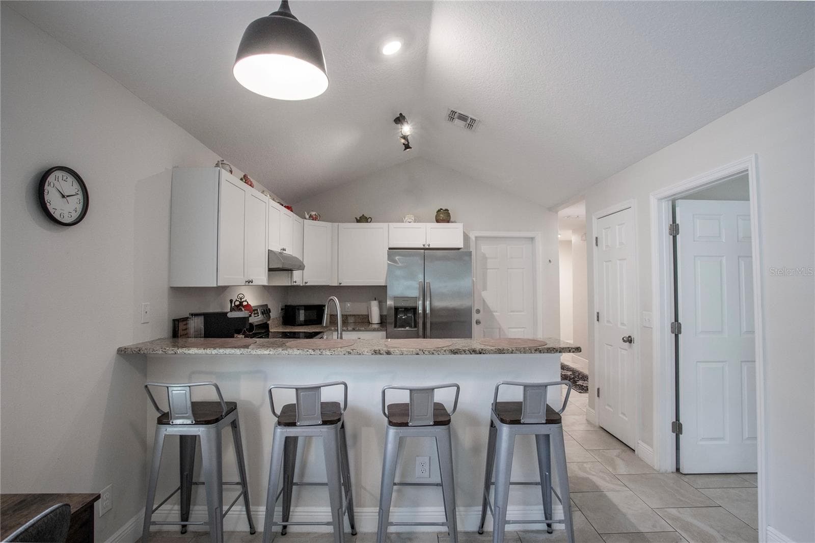 Breakfast bar at the kitchen counter - 1202 S DEWEY ST, EUSTIS