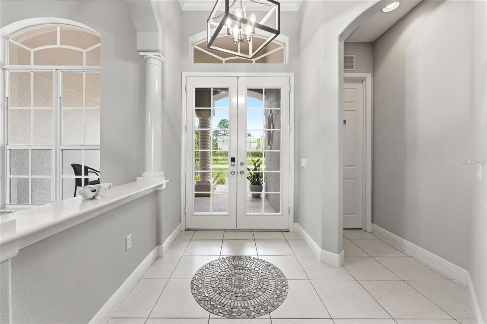A Welcoming Front Entryway With Lots of Natural Lighting - 24355 HIDEOUT TRL, LAND O LAKES