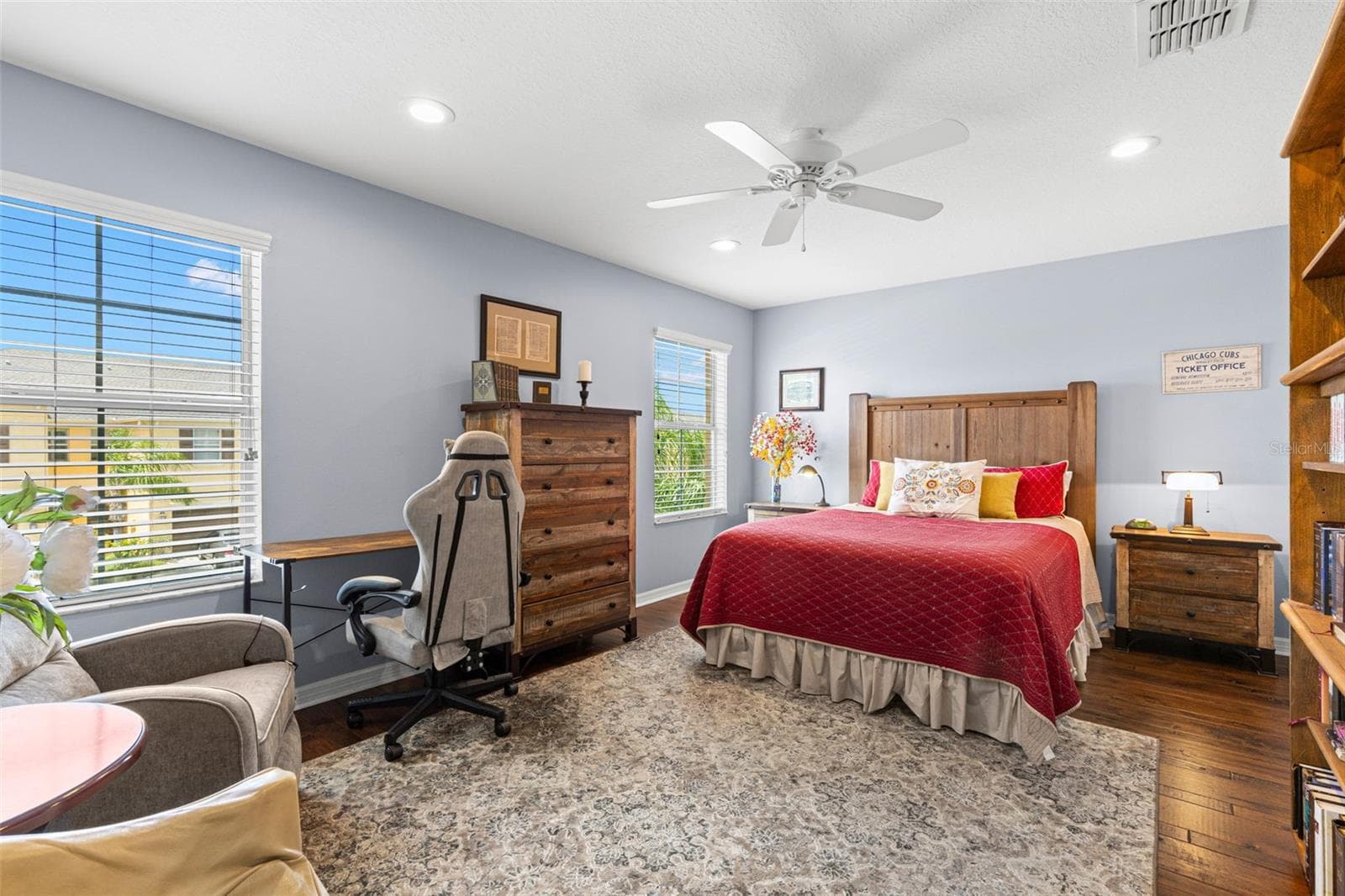 Bedroom 3 is generously sized, with hardwood flooring, a ceiling fan, recessed lighting and enough room for a desk or reading area. - 9524 TRUMPET VINE LOOP, NEW PORT RICHEY