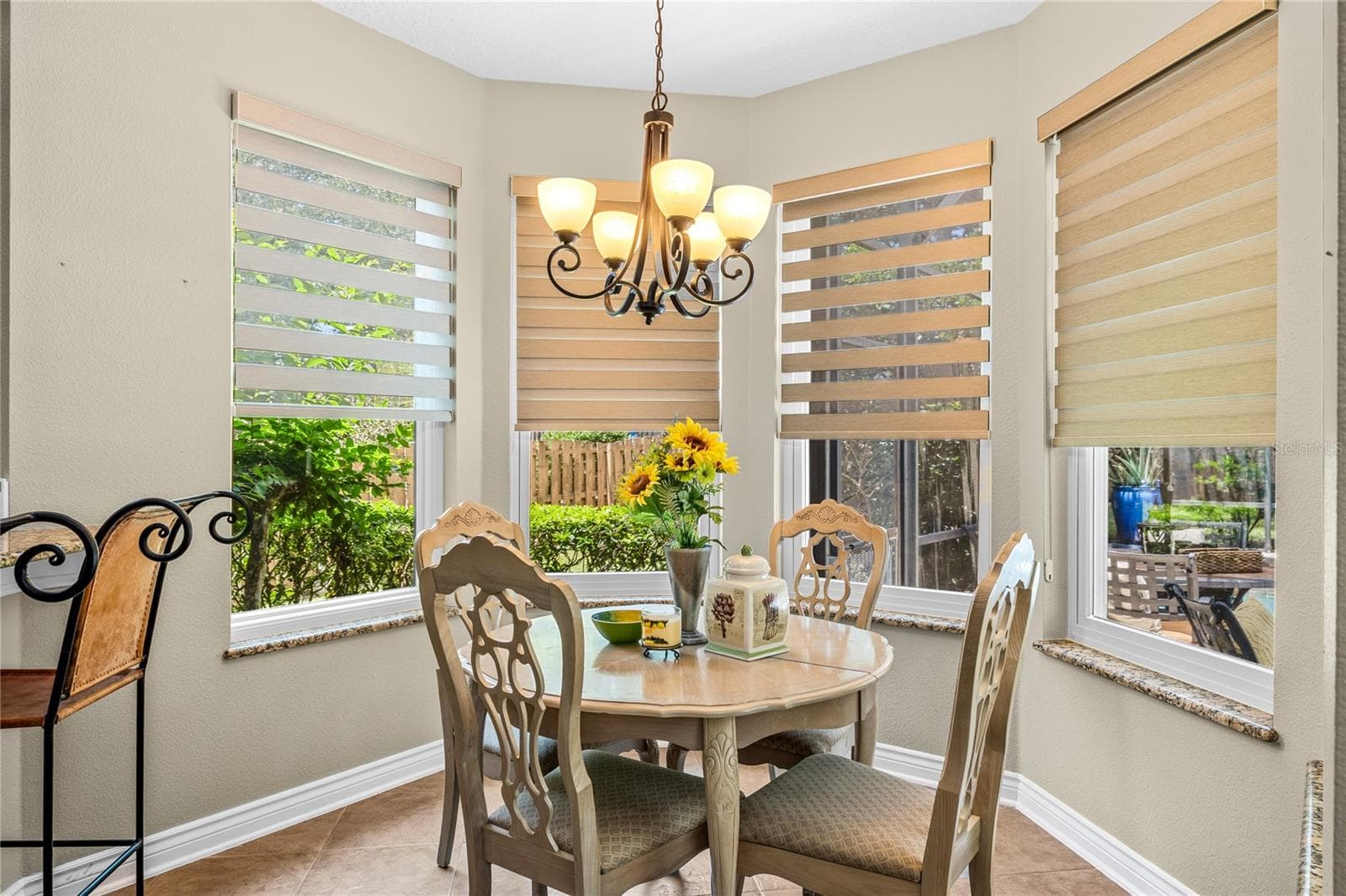The nook off the kitchen.All custom blinds with remotes - 483 VIA TUSCANY LOOP, LAKE MARY