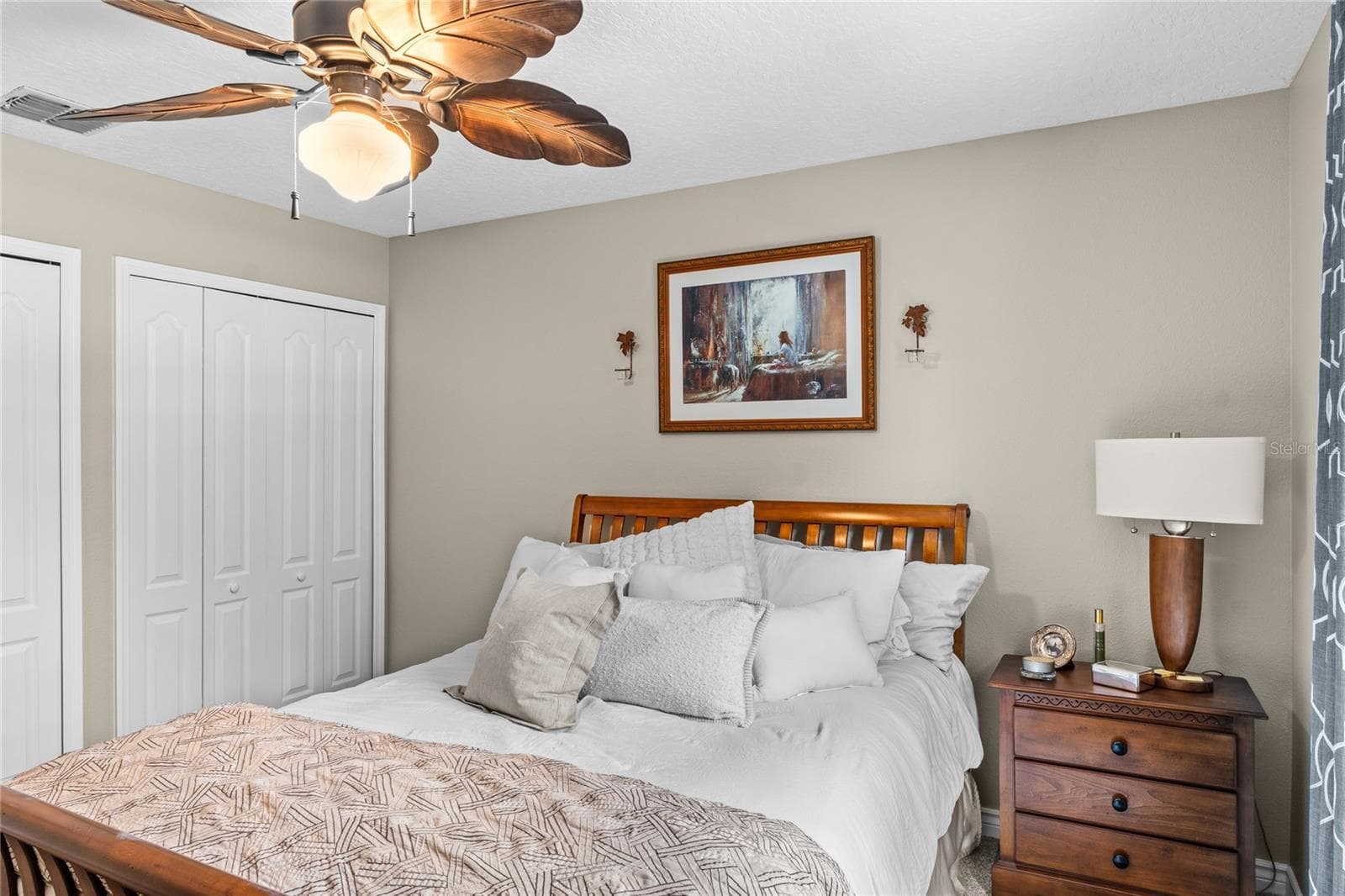 The secondary bedrooms have decorative ceiling fans. - 483 VIA TUSCANY LOOP, LAKE MARY