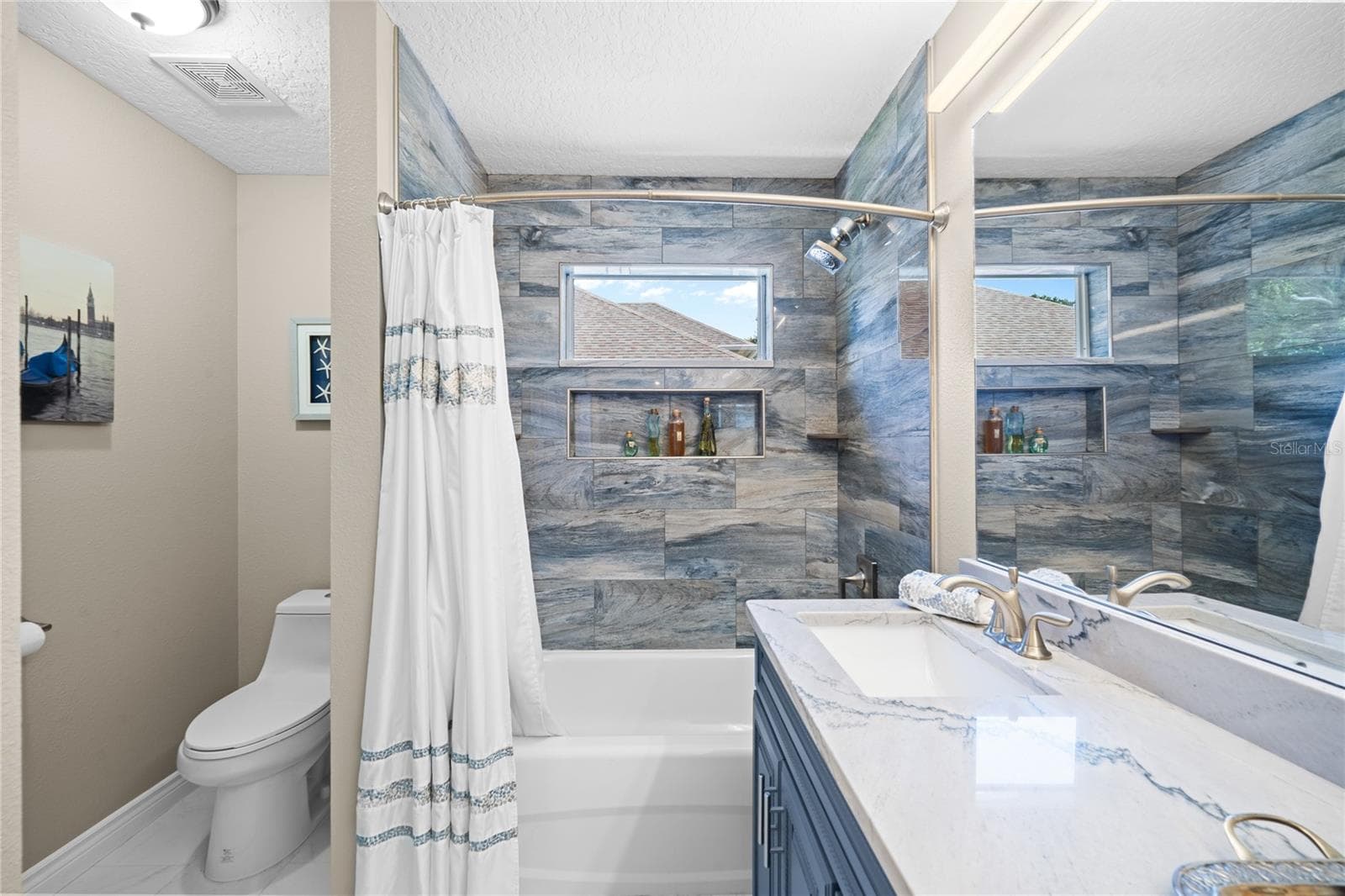 The second floor bath is like a spa. Blue themed color scheme with high end decor. - 483 VIA TUSCANY LOOP, LAKE MARY
