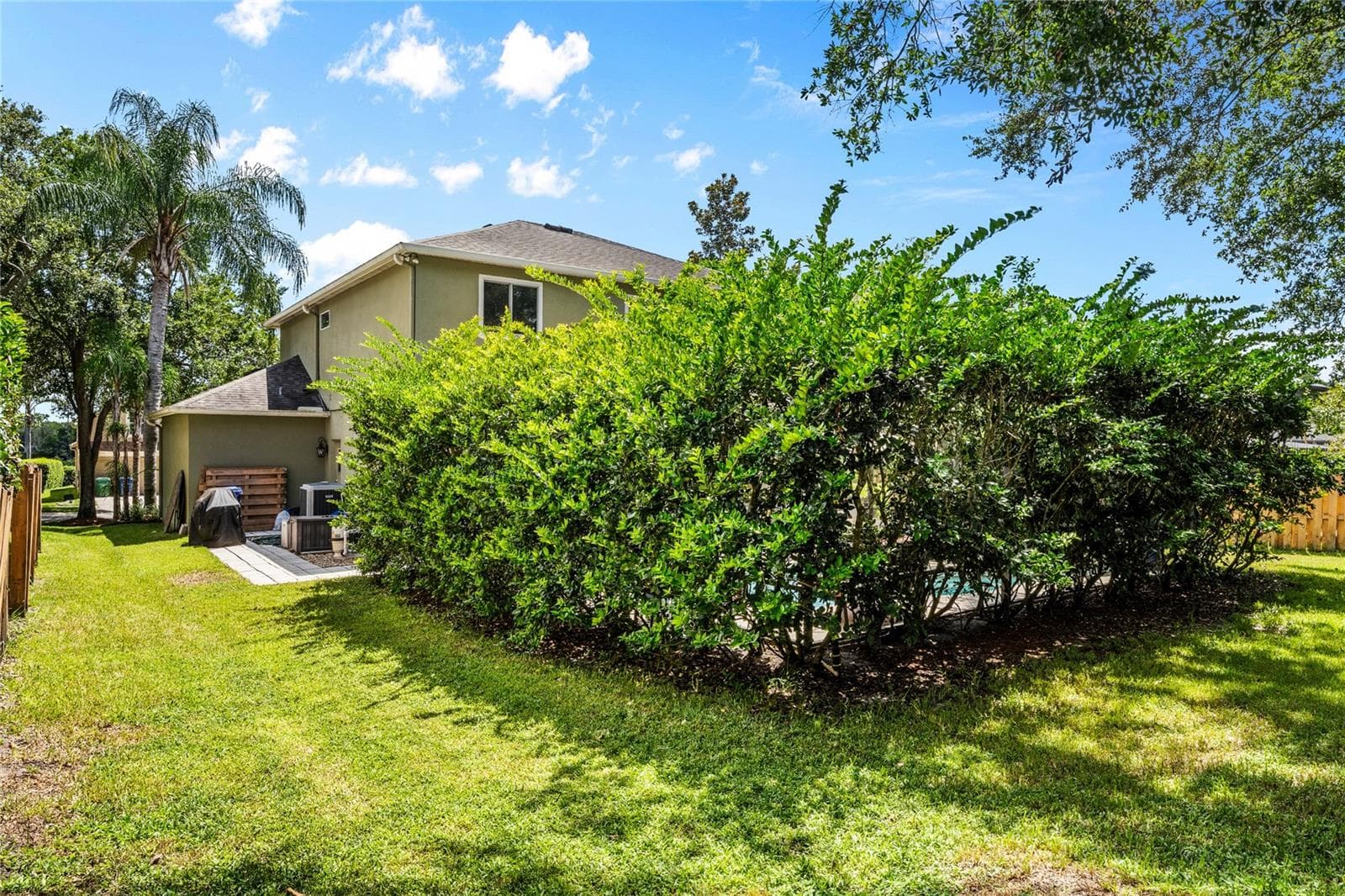 Privacy hedges surround the pool area. - 483 VIA TUSCANY LOOP, LAKE MARY