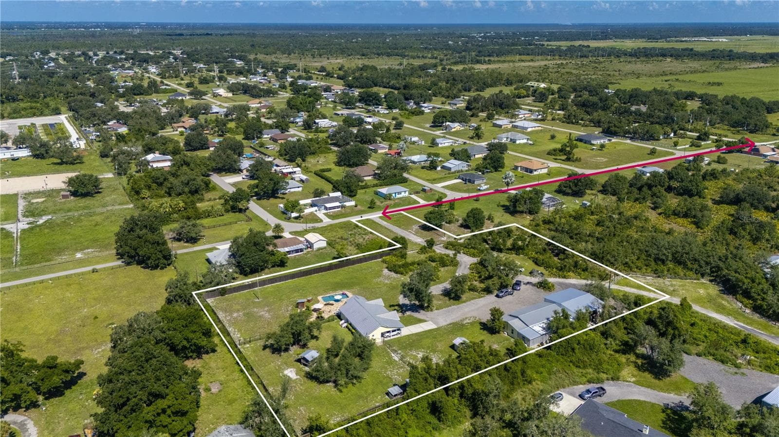 RED ARROW SHOWS ACCESS FROM WASHINGTON LOOP ON MANGROVE ROAD TO ENTRANCE - 30941 TURKEY OAK RD, PUNTA GORDA