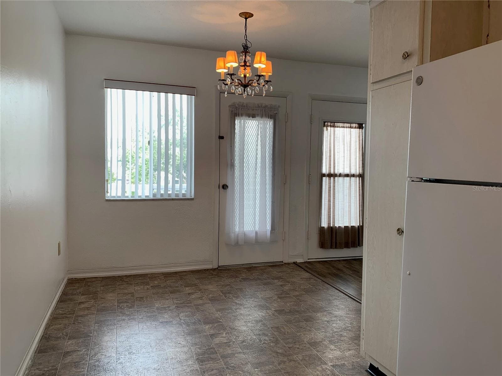 Looking at the dining area from the kitchen - 8126 112TH ST #203, SEMINOLE