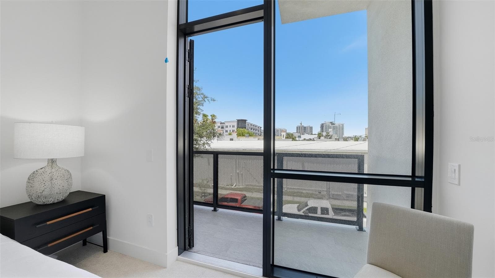 This primary suite is spacious and also light, bright which features a walk in closet and full bath with dual sinks as well as its own private west facing patio. - 430 KUMQUAT CT #202, SARASOTA