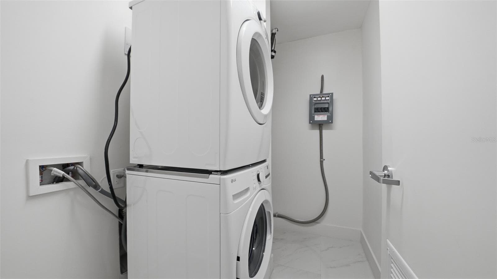 This move in ready condo features stacked full size washer/dryer and room for storage in this mechanical room. - 430 KUMQUAT CT #202, SARASOTA