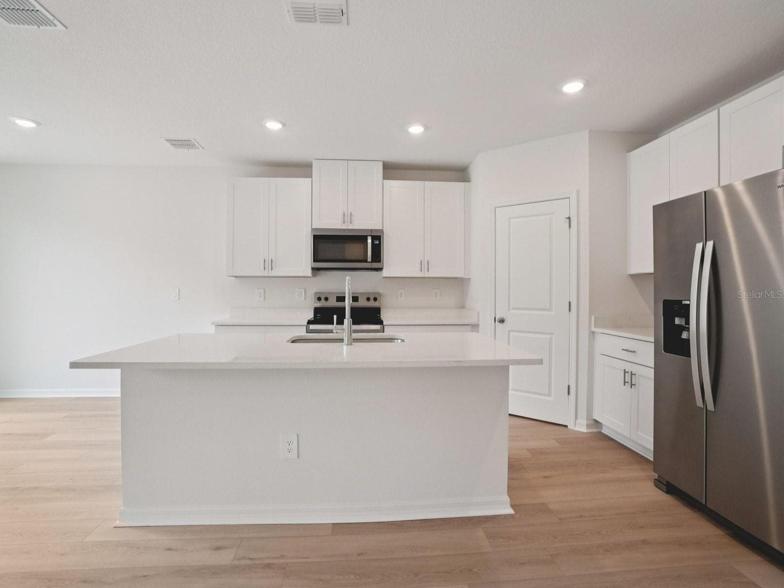 Photo is not of the actual home, but is an inspirational photo of builder’s model home and may depict options, furnishings, and/or decorator features that are not included - 17661 OLIVE THORN DR, BROOKSVILLE