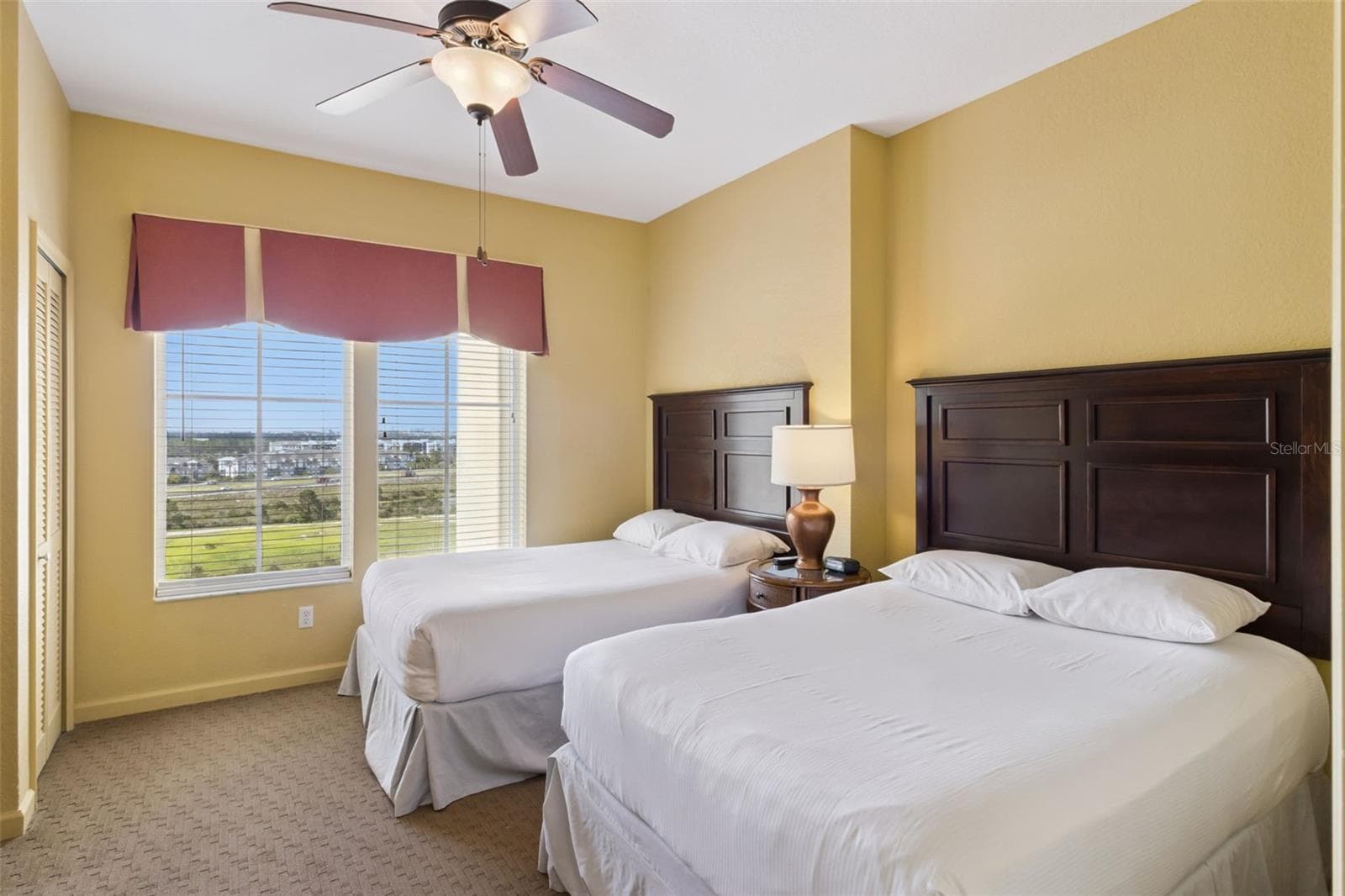 Guest Bedroom | Two beds and a large window make this room well suited for accommodating additional guests. - 8101 RESORT VILLAGE DR #31110, ORLANDO