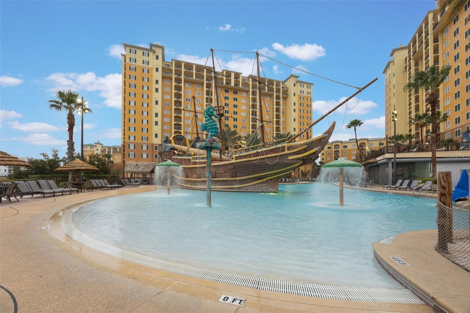 Resort Pool | The expansive zero-entry pool features playful pirate-themed elements and generous surrounding deck space. - 8101 RESORT VILLAGE DR #31110, ORLANDO
